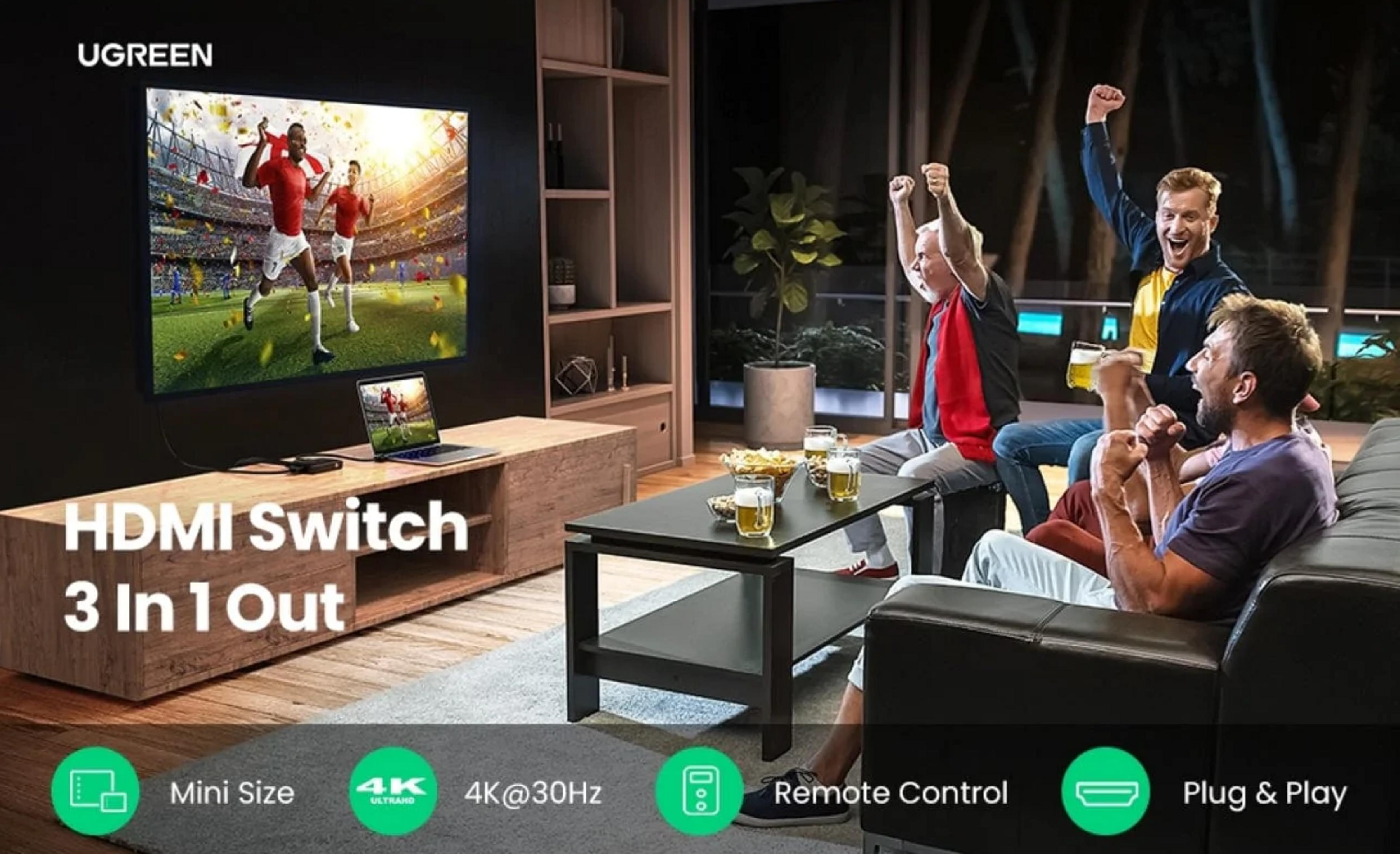 Ludzie kibicują, oglądając mecz piłki nożnej w telewizji. Przełącznik HDMI 3-w-1.