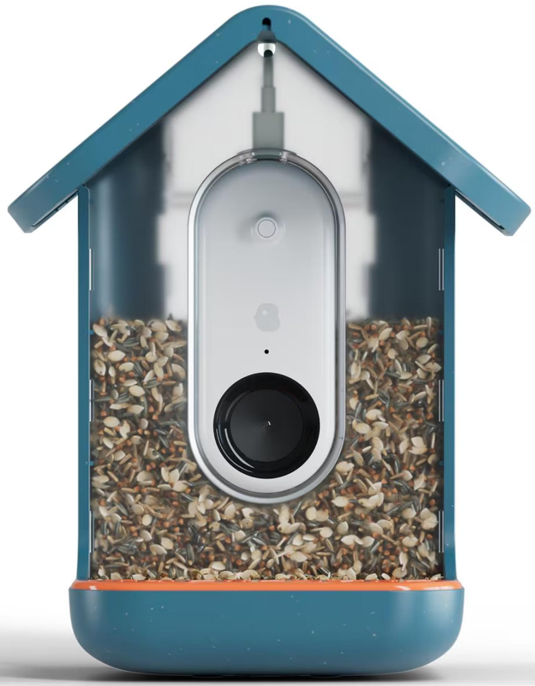 Un comedero azul con forma de casa para pájaros con cámara y semillas.