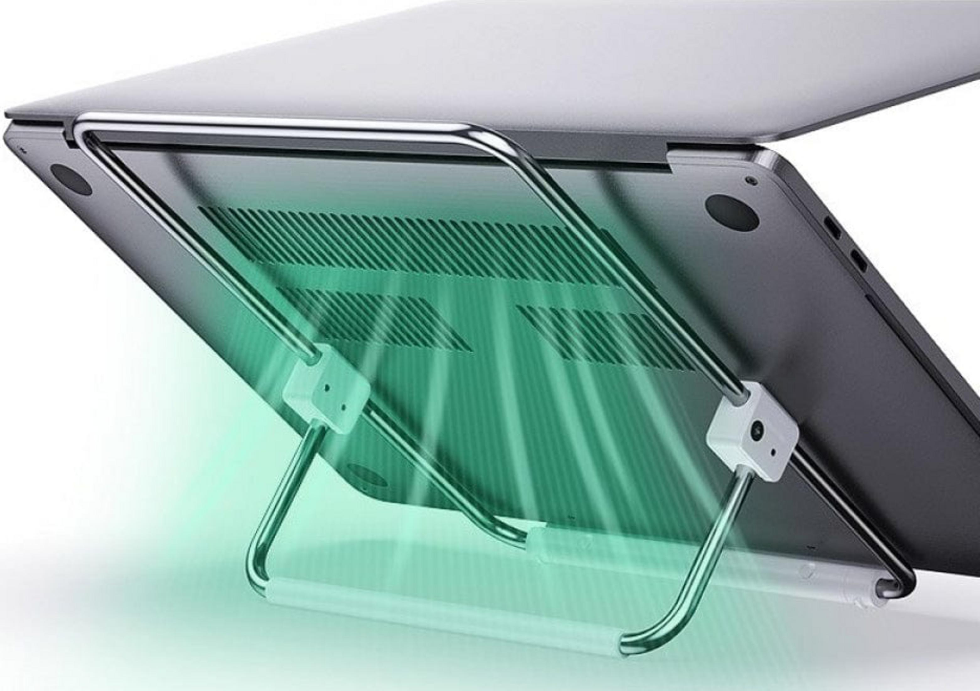 Srebrny laptop na stojaku z zielonymi promieniami światła.