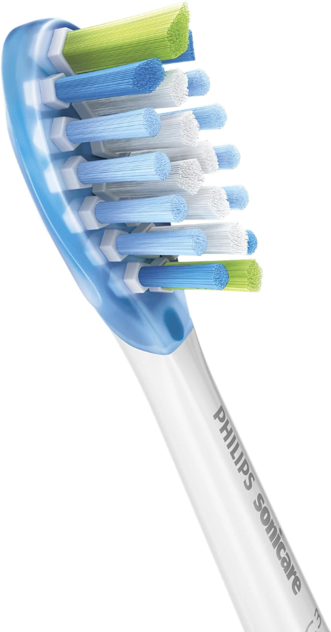 Close-up of an electric toothbrush head with blue, white, and green bristles.