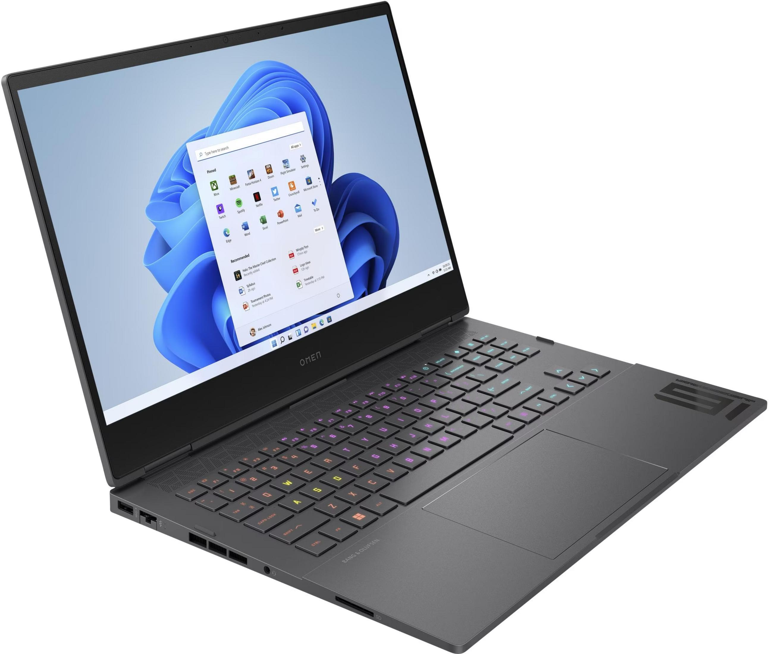Ein offener Laptop mit Windows 11-Startmenü und beleuchteter Tastatur.