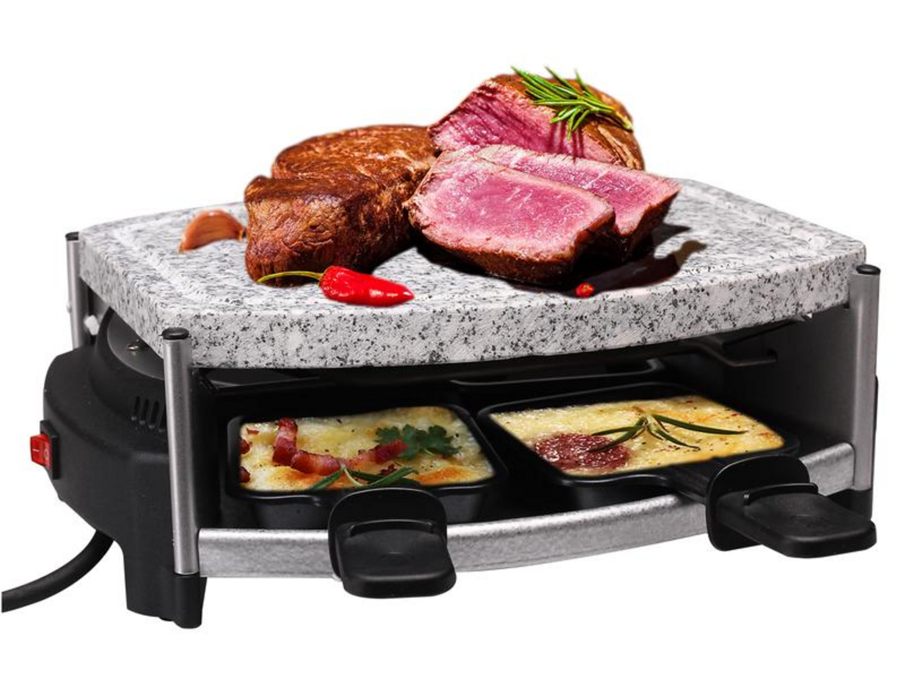 Un grill raclette avec plaque en pierre, garni de steaks, piment et ail. Deux coupelles de nourriture sont en dessous.