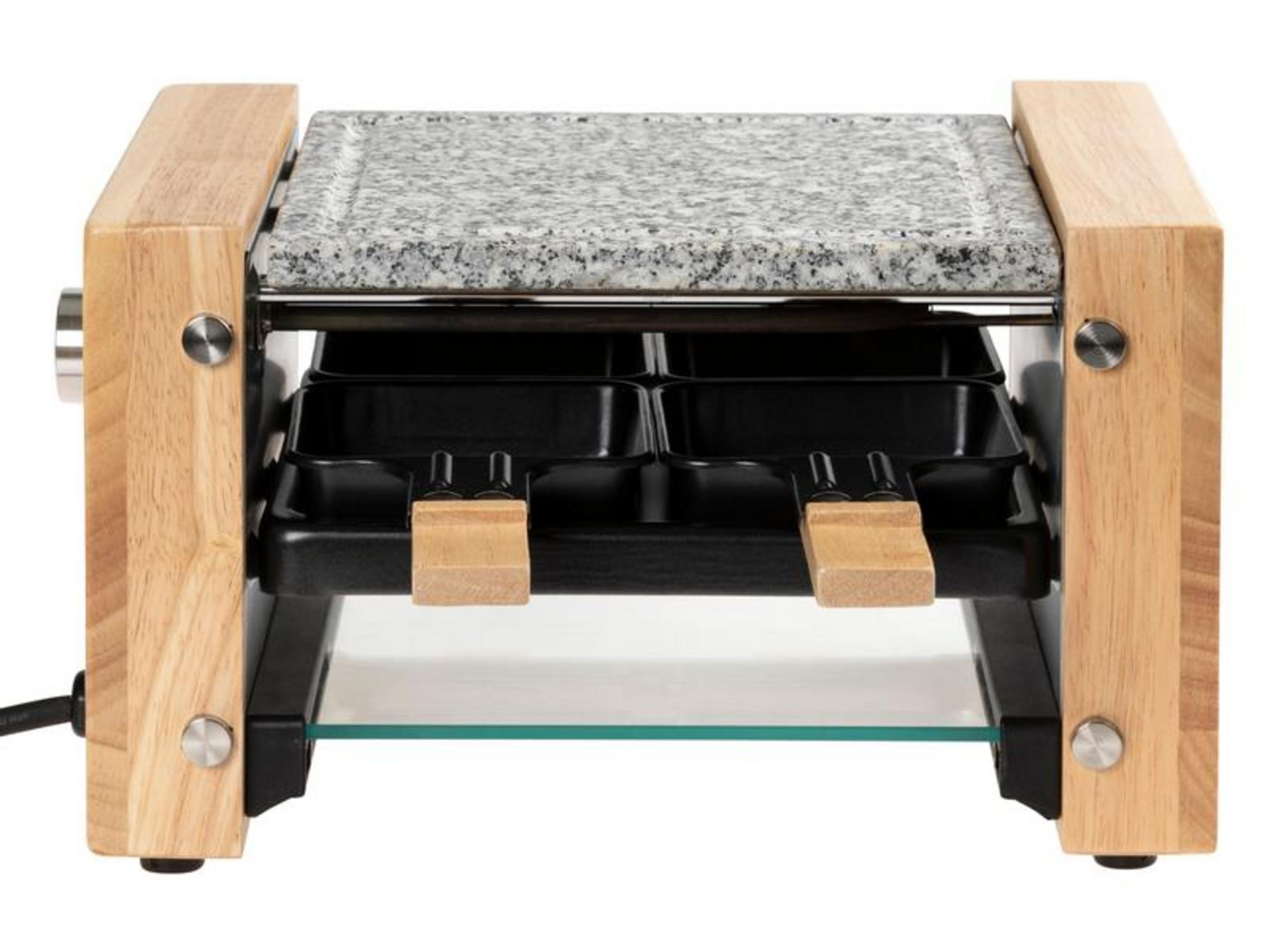Ein Raclette-Grill mit Steinplatte, Holzakzenten und schwarzen Pfannen.