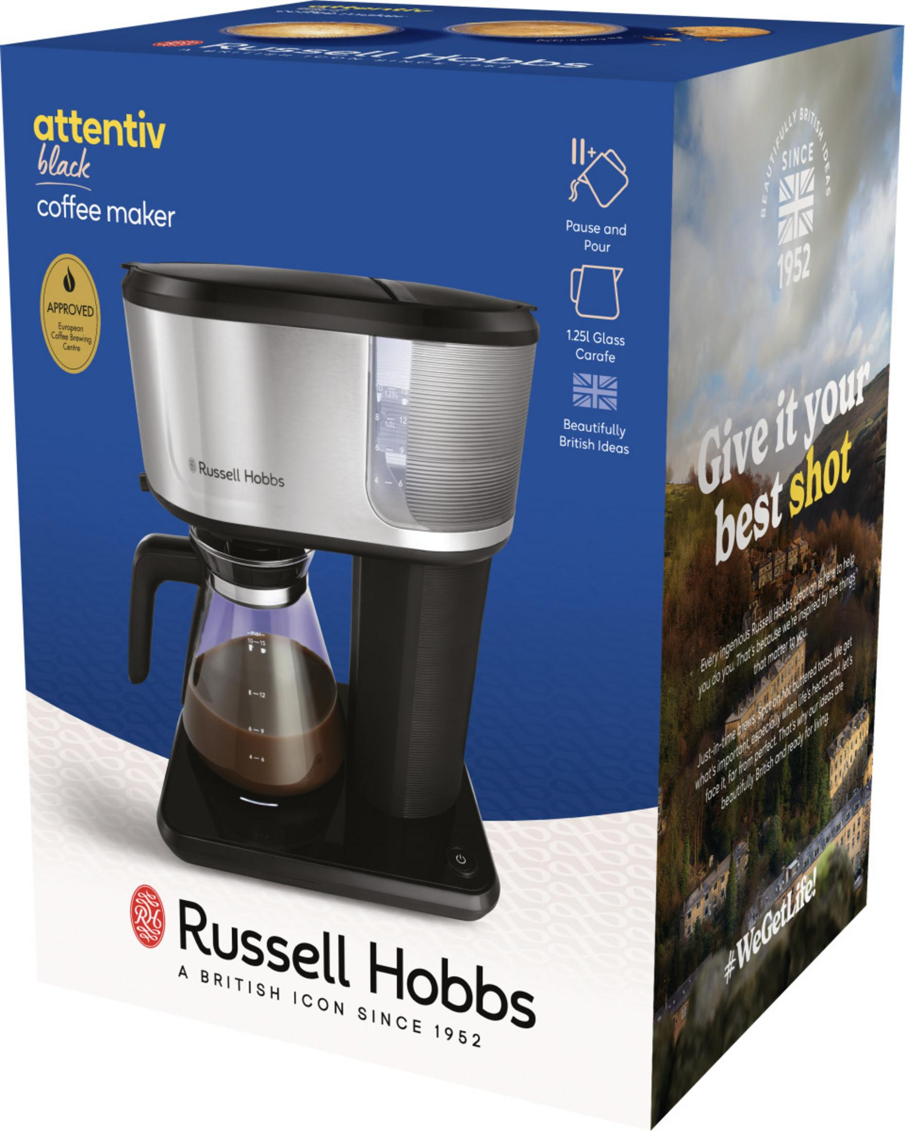 Eine schwarze Russell Hobbs Kaffeemaschine mit Glaskaraffe und Kaffee auf der Verpackung.