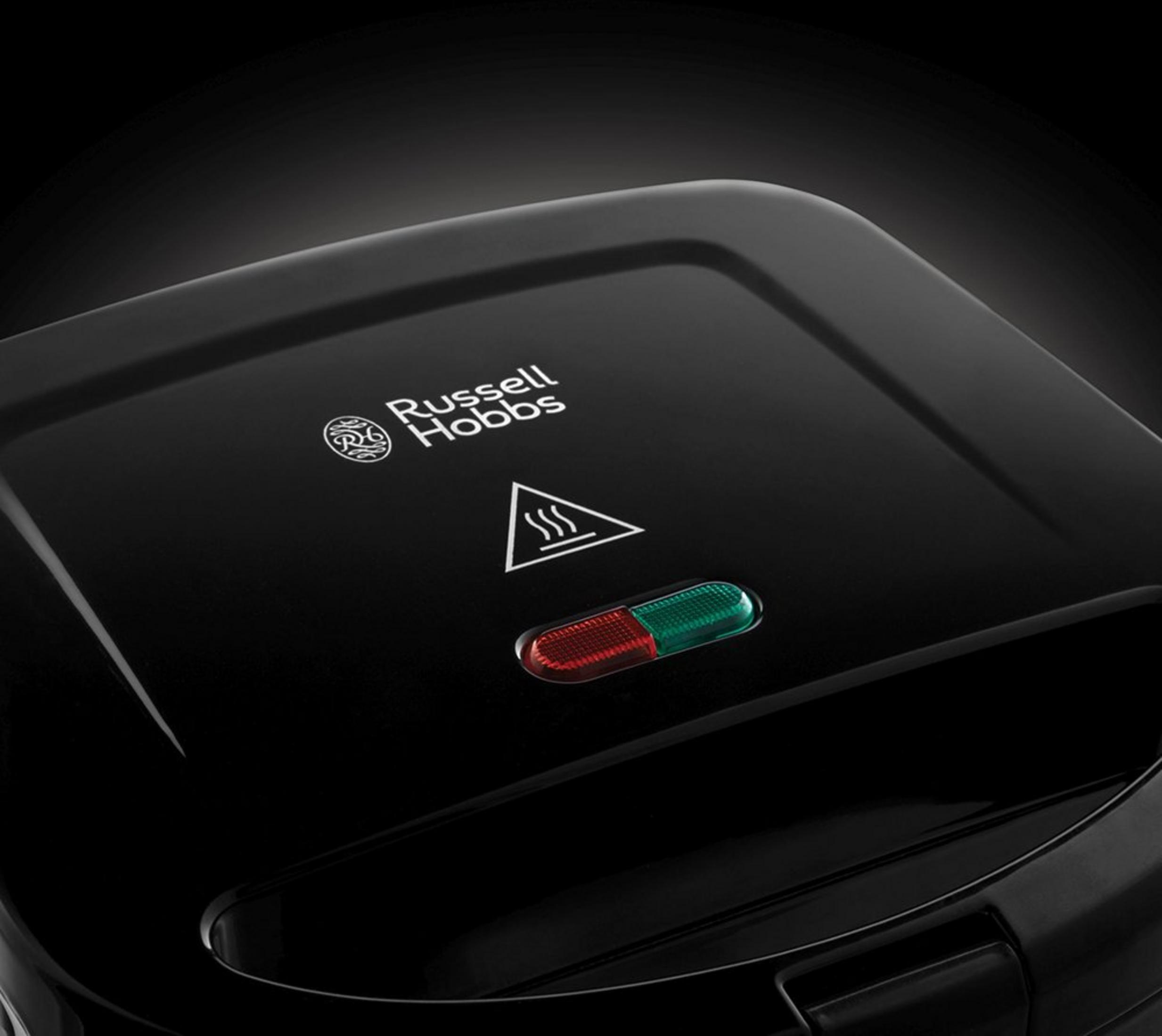 Schwarzer Russell Hobbs Toaster mit roten und grünen Kontrollleuchten.