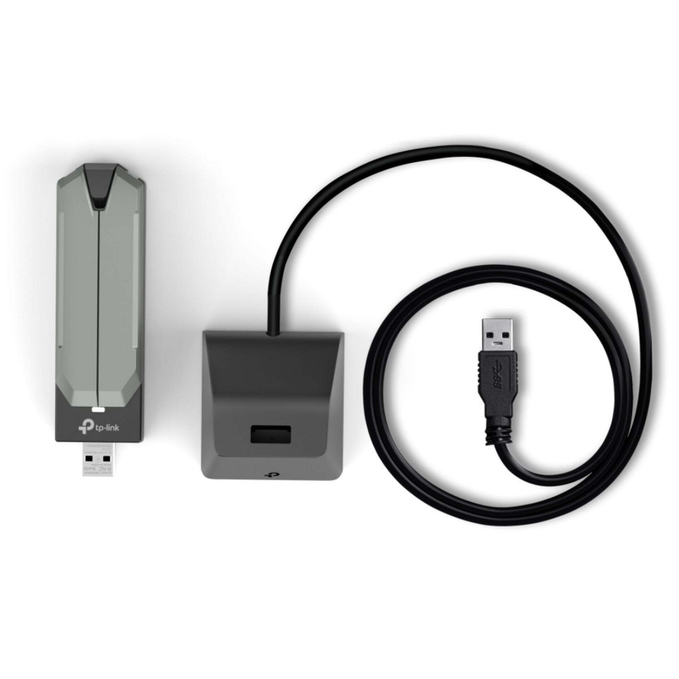 Dongle USB TP-Link grigio con dock nero e cavo USB.