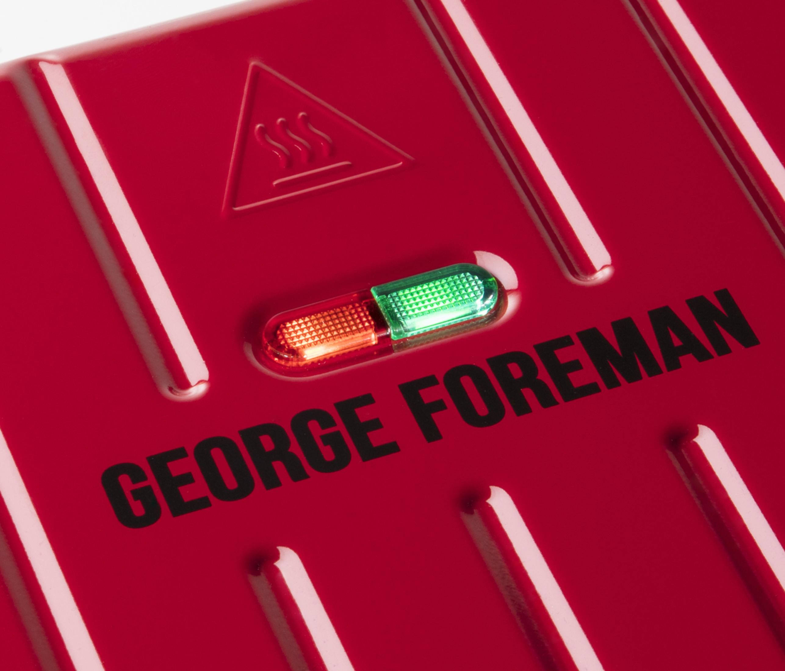 Grill rosso George Foreman con spie luminose e simbolo di avvertenza.