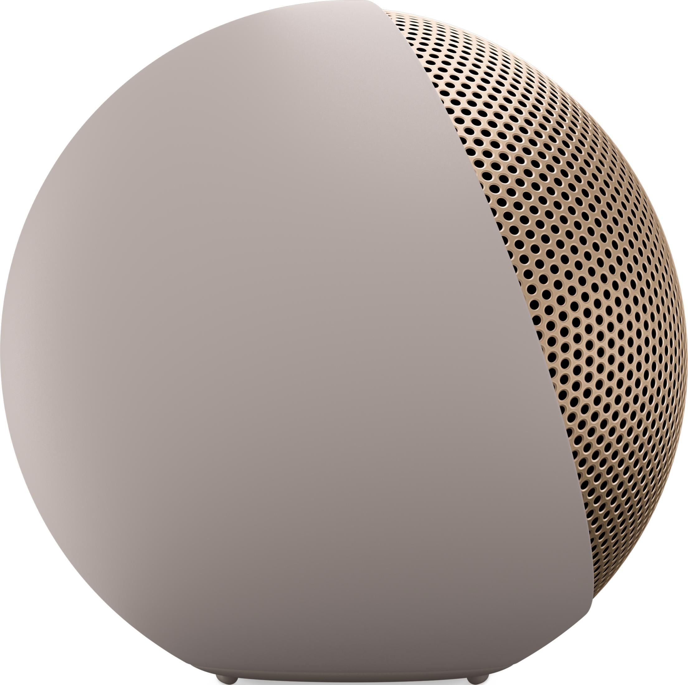 Kulisty, beżowy głośnik ze złotą perforowaną kratką.