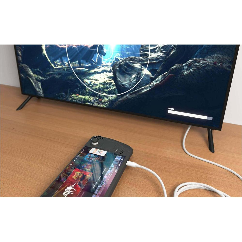 Un dispositivo portatile è collegato via cavo a una TV che mostra un videogioco.