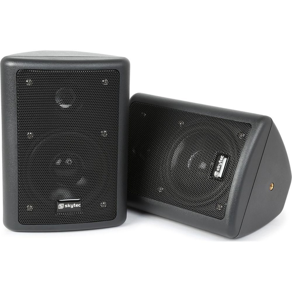 Dos altavoces negros, uno de pie y el otro tumbado.