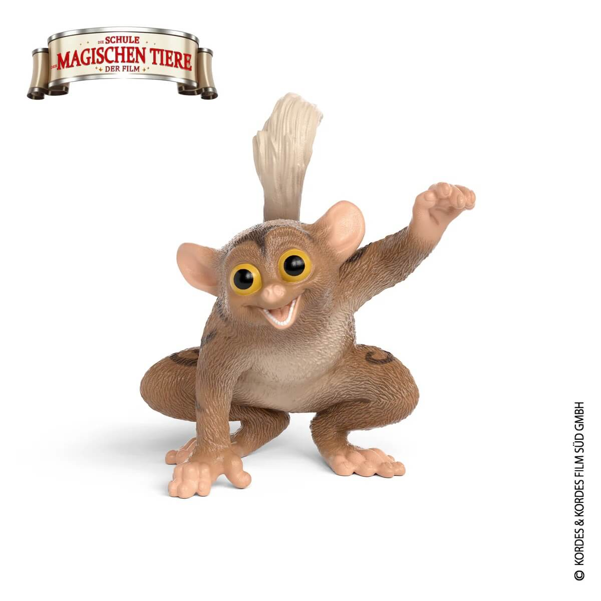 Ein kleines, braunes Tarsier-Äffchen mit großen Augen kauert und hebt eine Hand.