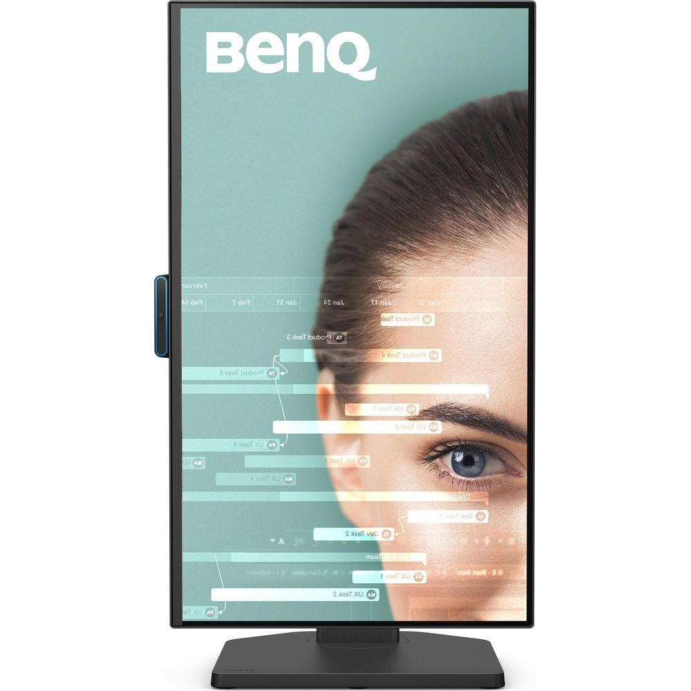 A BenQ monitor displays a woman's blue eye against a backdrop of data. The BenQ logo is visible.