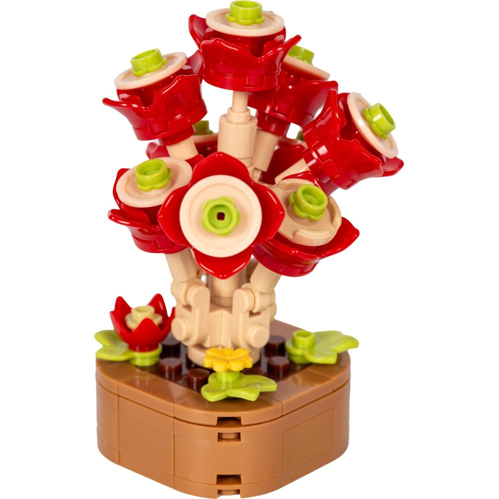 Un bouquet de fleurs Lego avec des fleurs rouges, des accents verts et un pot marron.