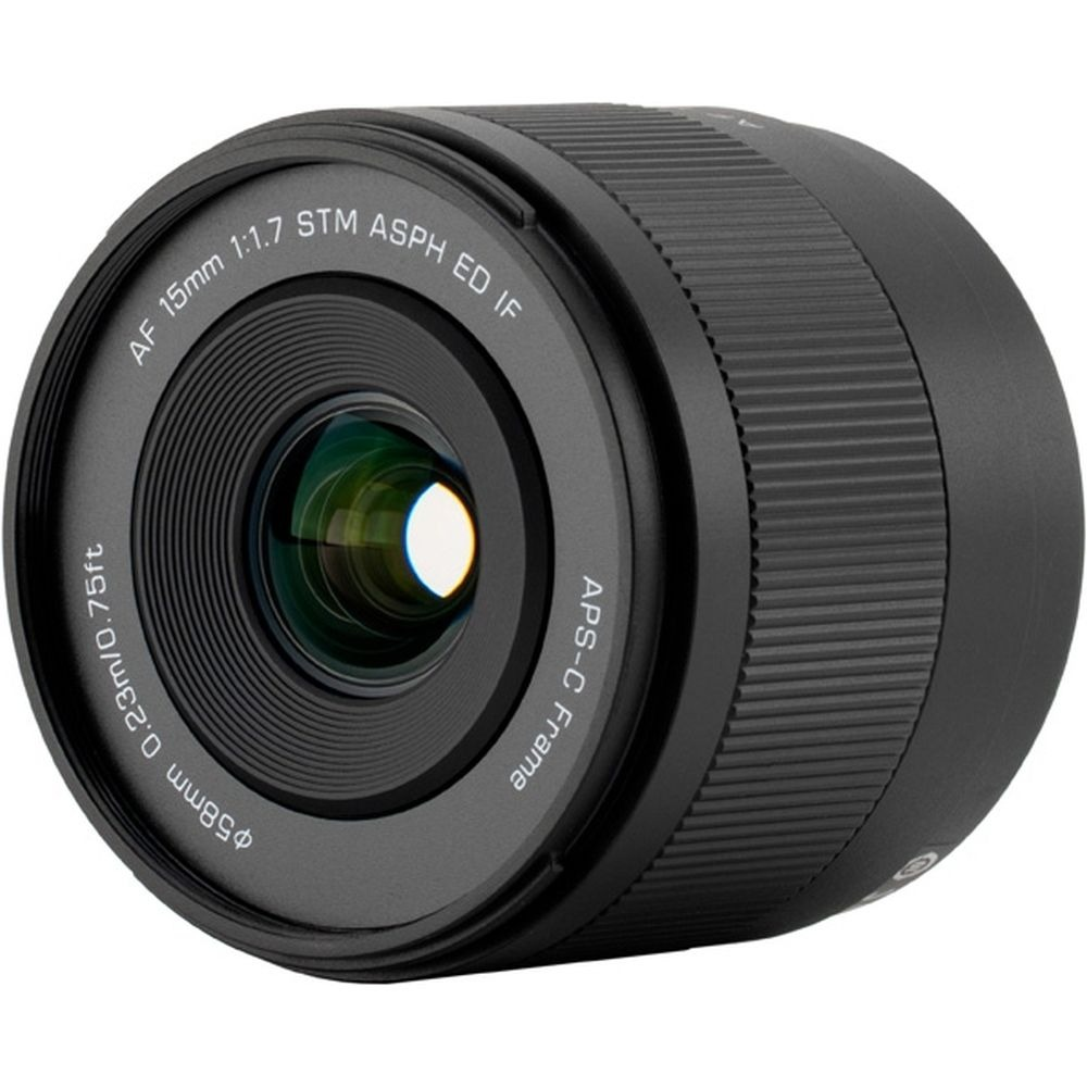 Un obiettivo nero con AF 15mm 1:1.7 STM ASPH ED IF e frame APS-C.