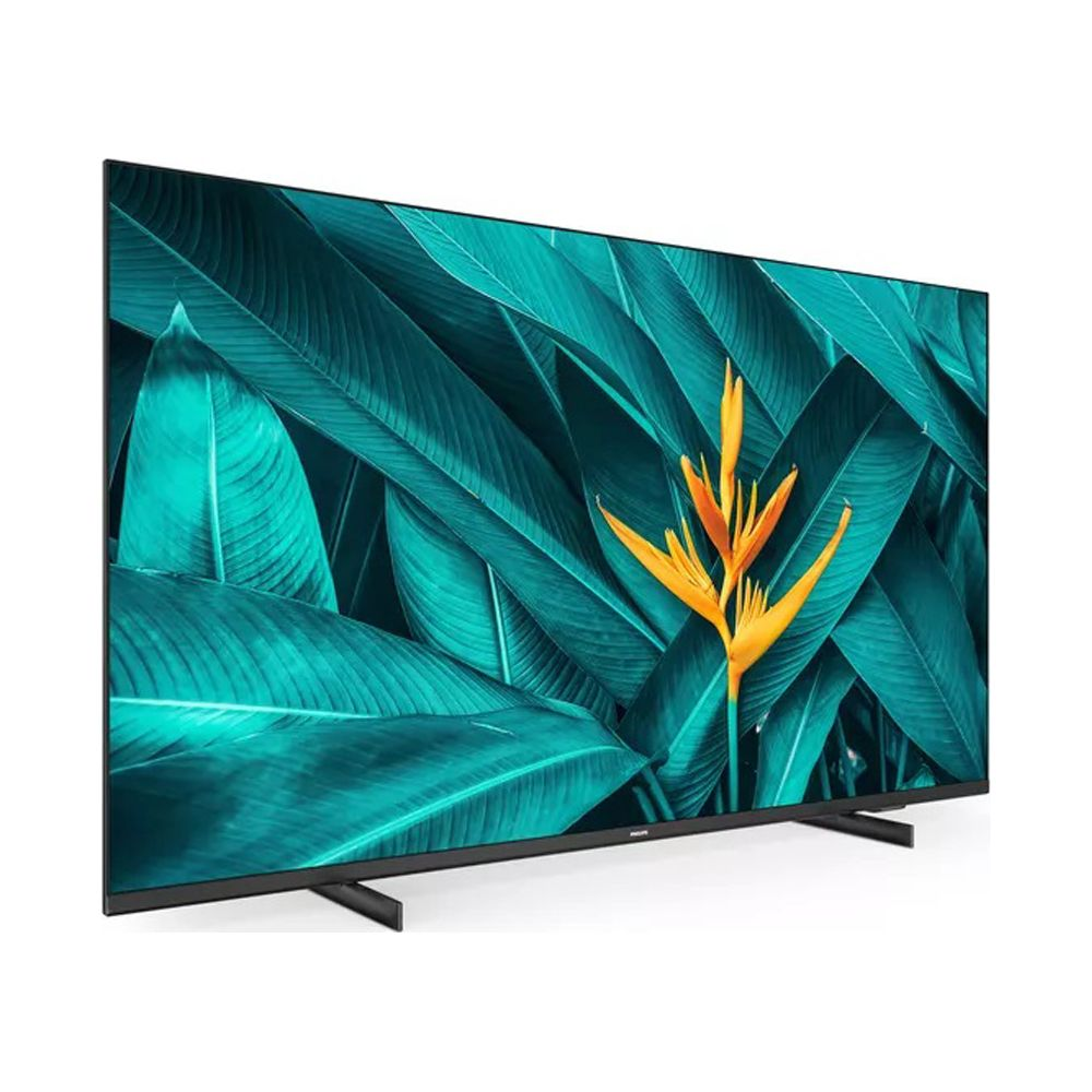 Nowoczesny telewizor wyświetla jaskrawo pomarańczowy kwiat helikoni na tle ciemnozielonych liści.