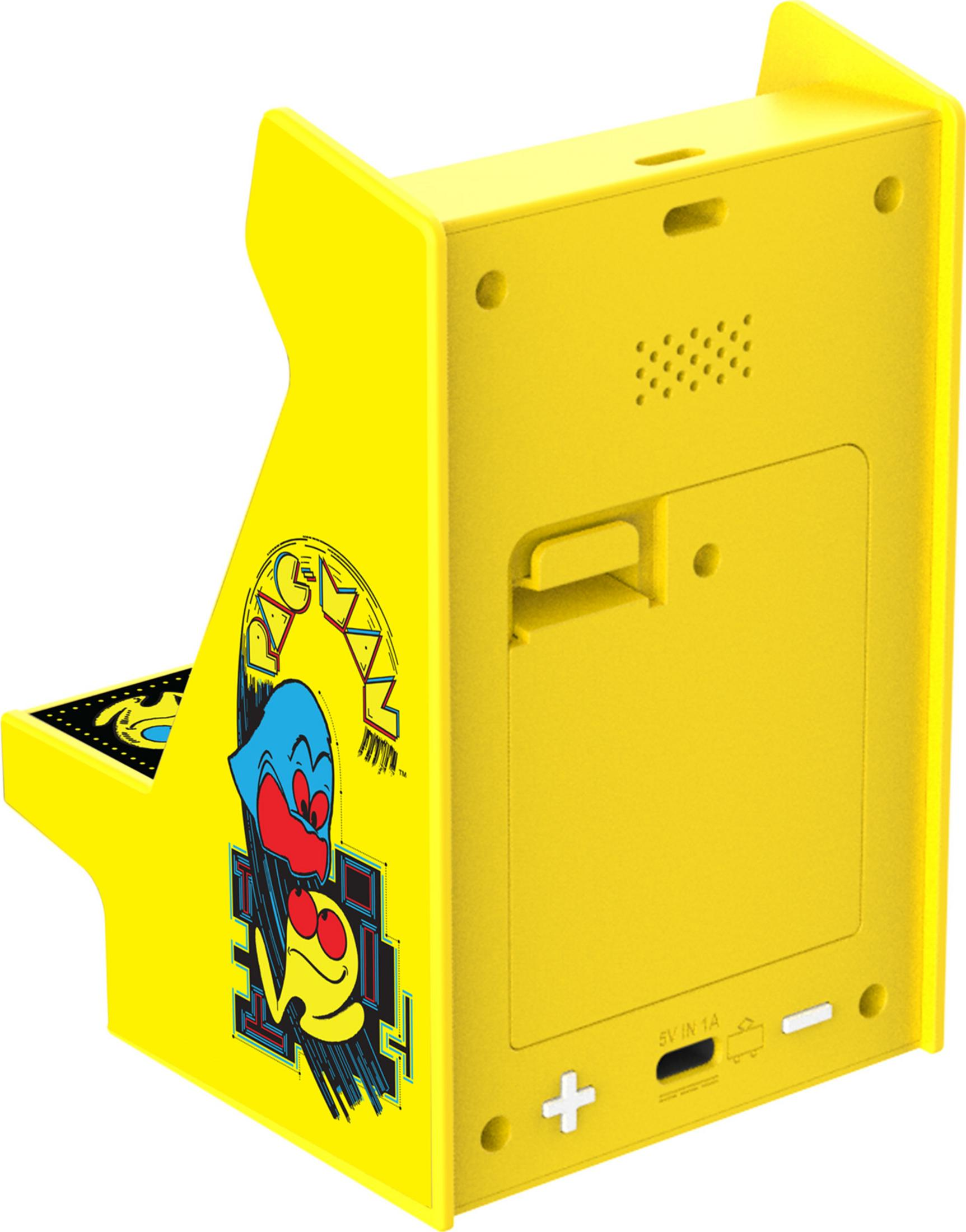 Żółta obudowa z grafiką Pac-Mana i tylnymi kontrolkami, ze złączami.