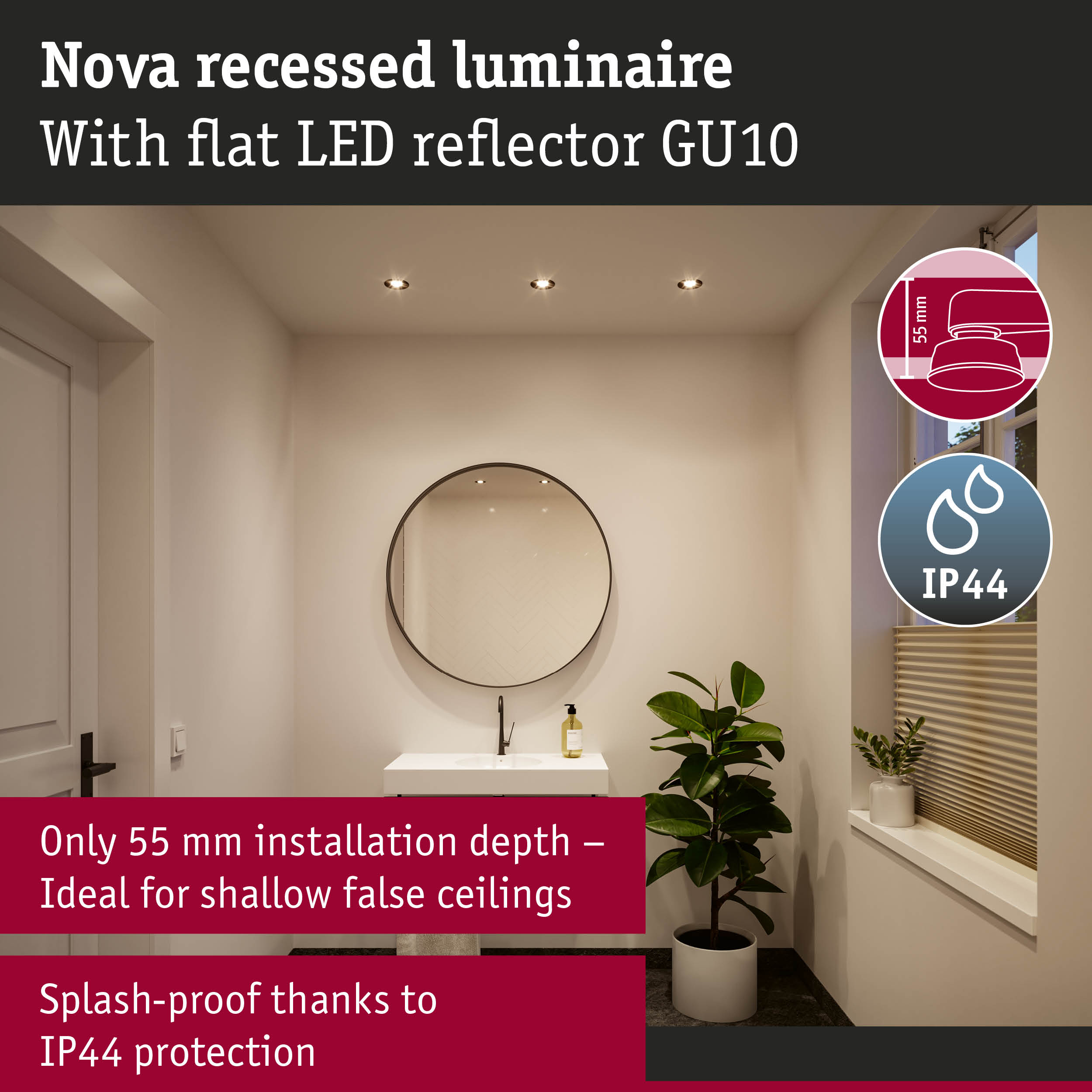 Łazienka z lampami wpuszczanymi, lustrem, umywalką i rośliną.