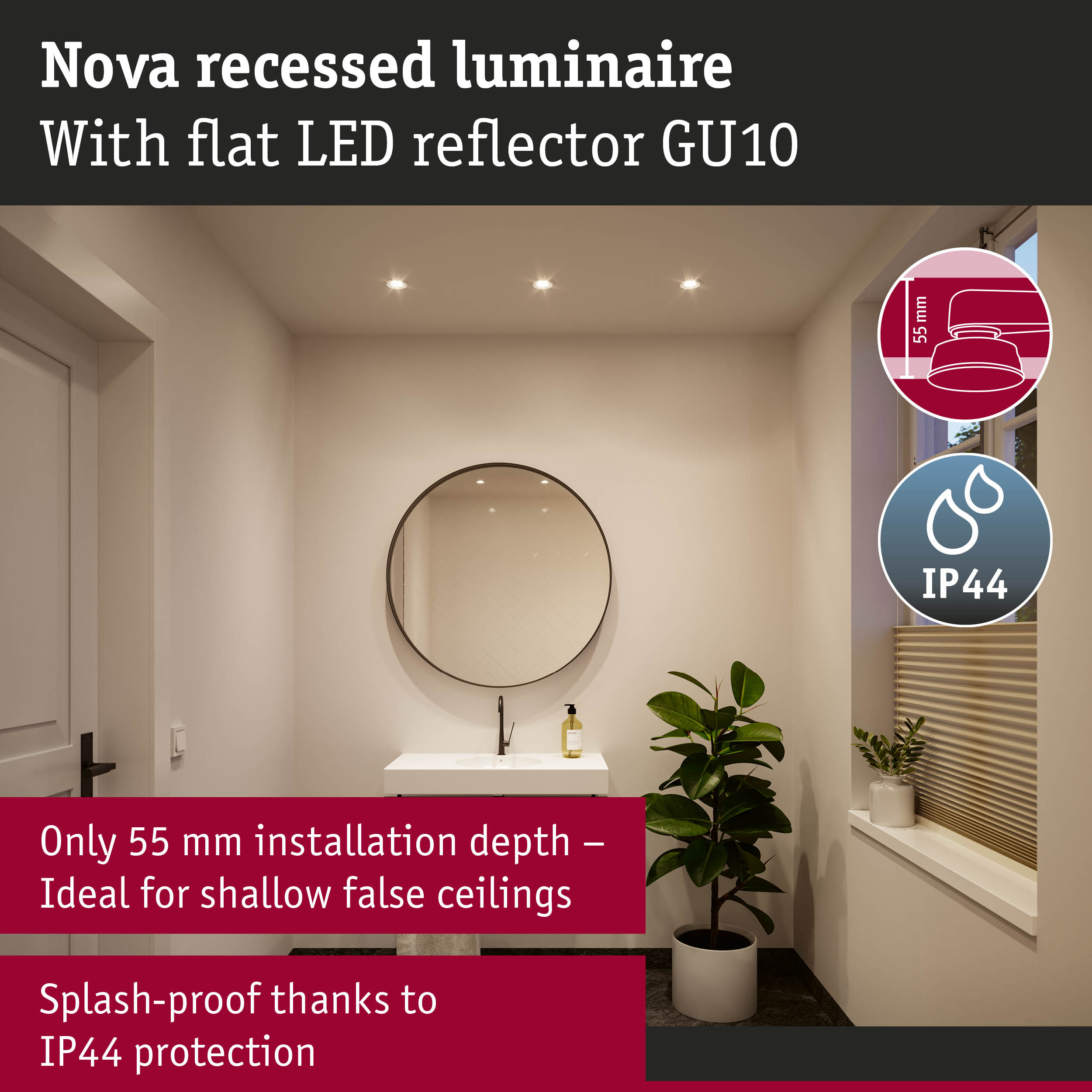 Łazienka z umywalką, lustrem, rośliną i oświetleniem sufitowym.