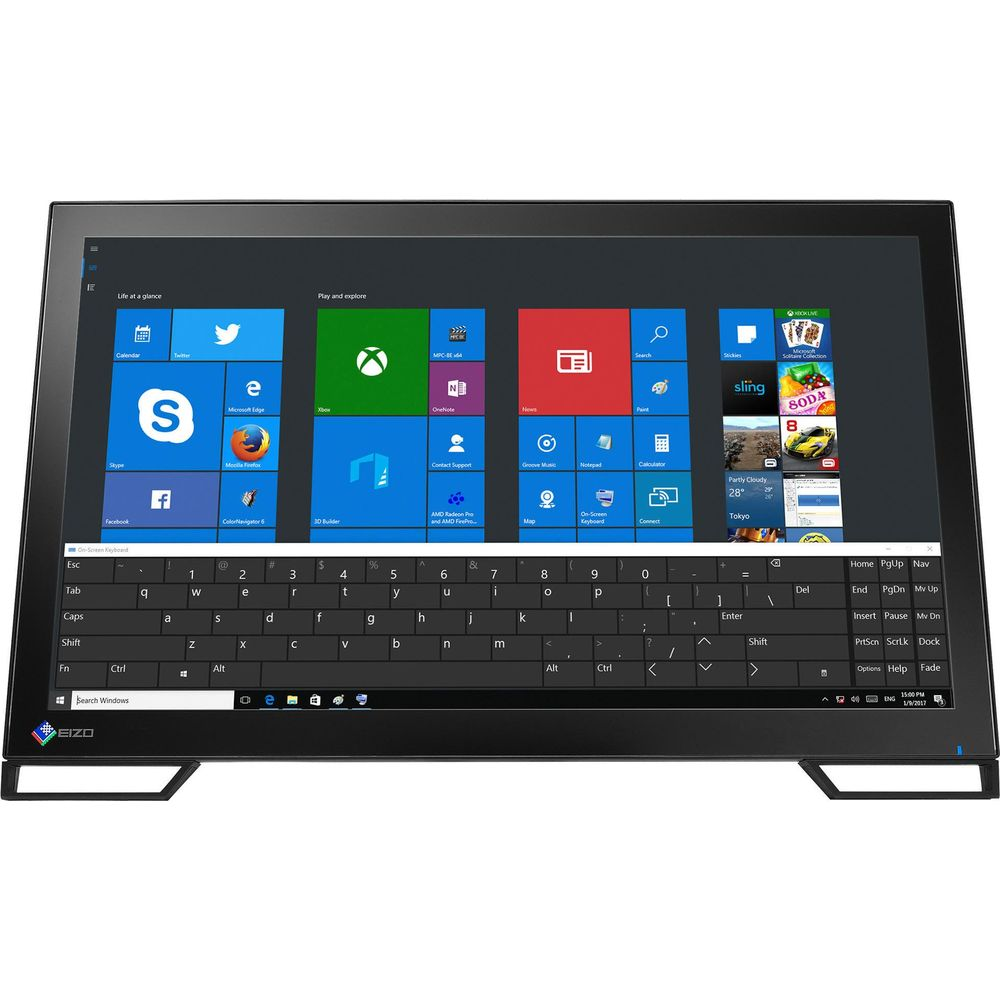 Se muestra un PC todo en uno negro con menú de inicio de Windows y teclado.
