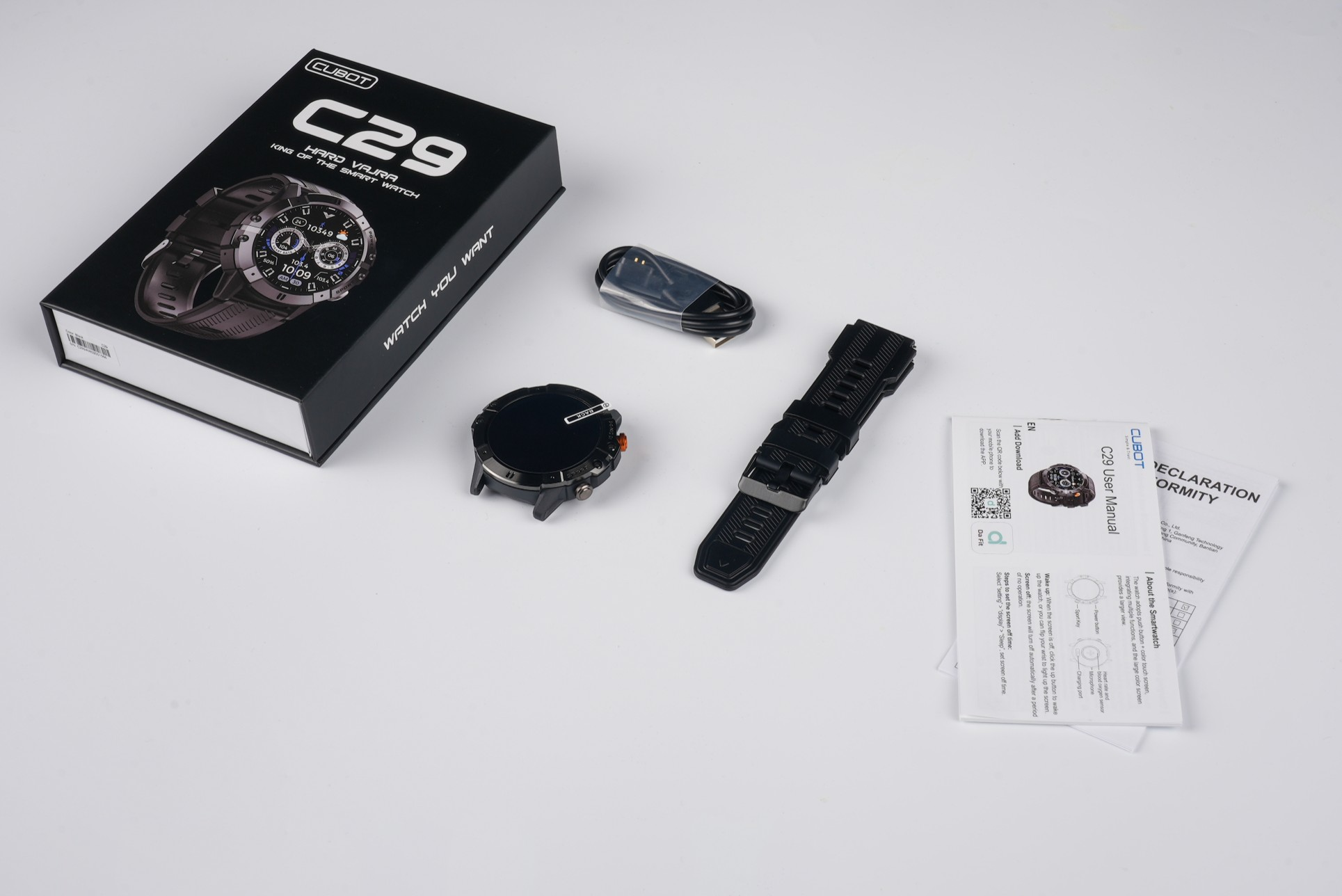 Zestaw smartwatcha Cubot C29 z pudełkiem, zegarkiem, kablem ładującym, zapasowym paskiem i instrukcją.