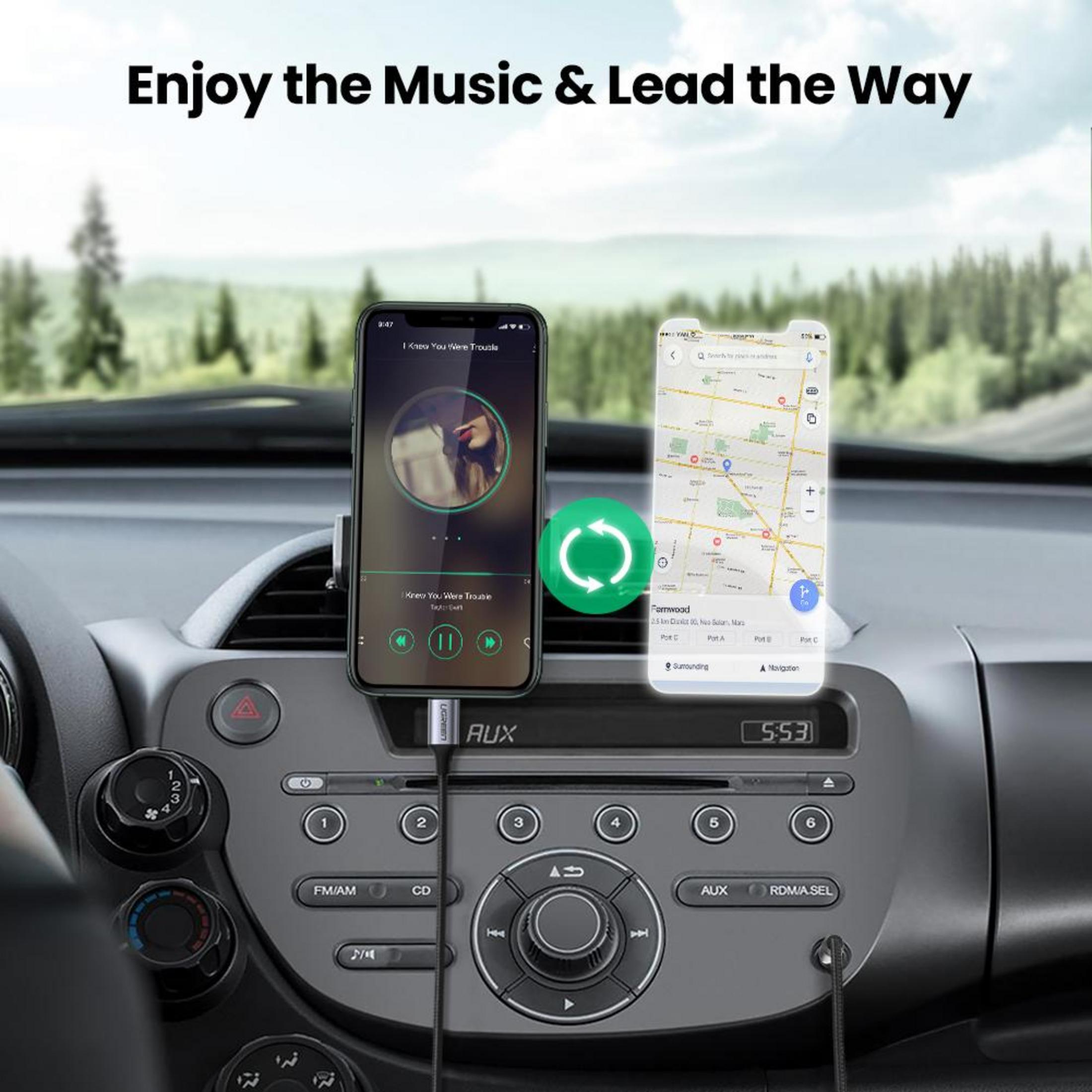 Dwa smartfony w samochodzie: jeden odtwarza muzykę, drugi pokazuje aplikację nawigacyjną.