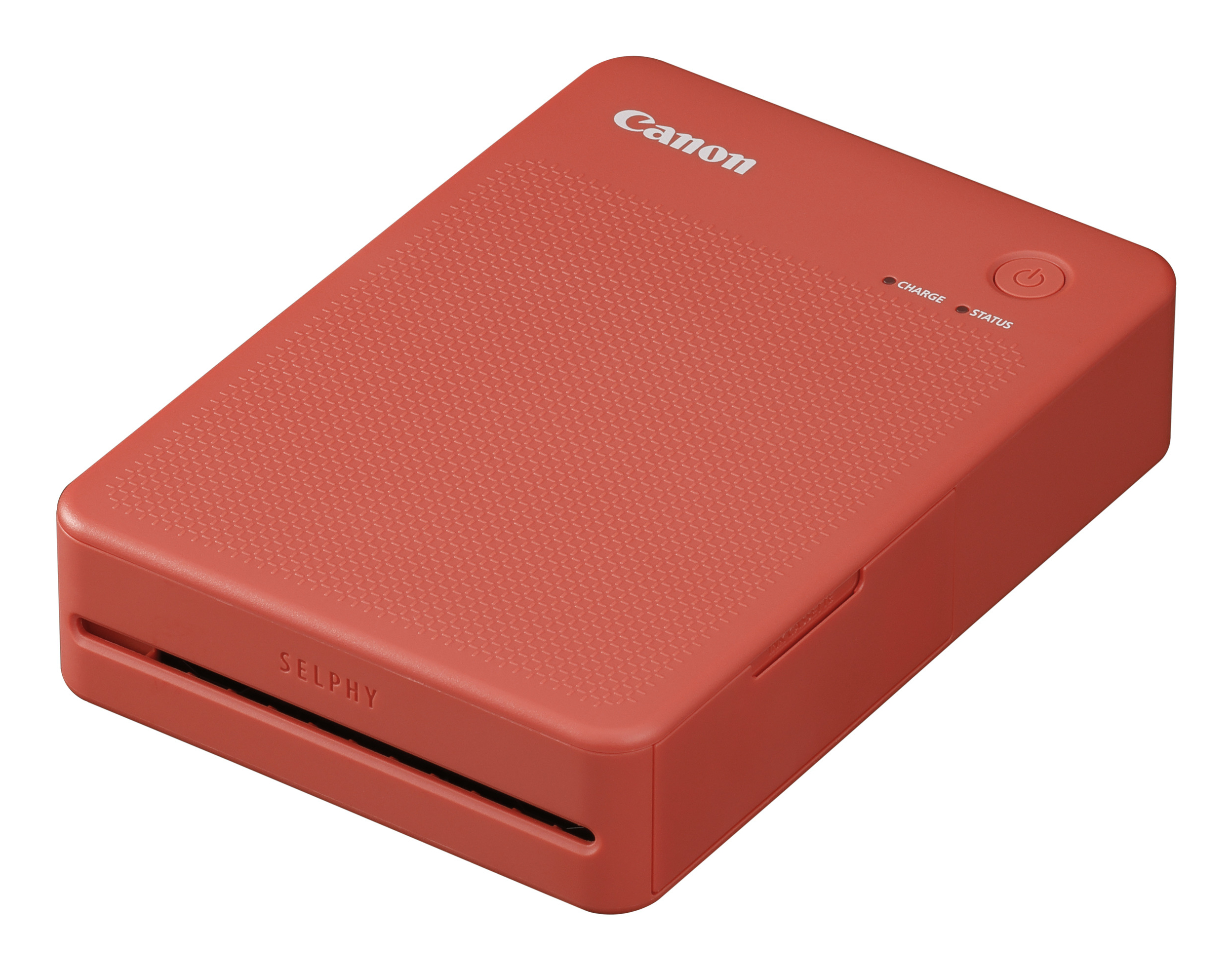 Una impresora fotográfica Canon SELPHY compacta, roja coral, con textura.