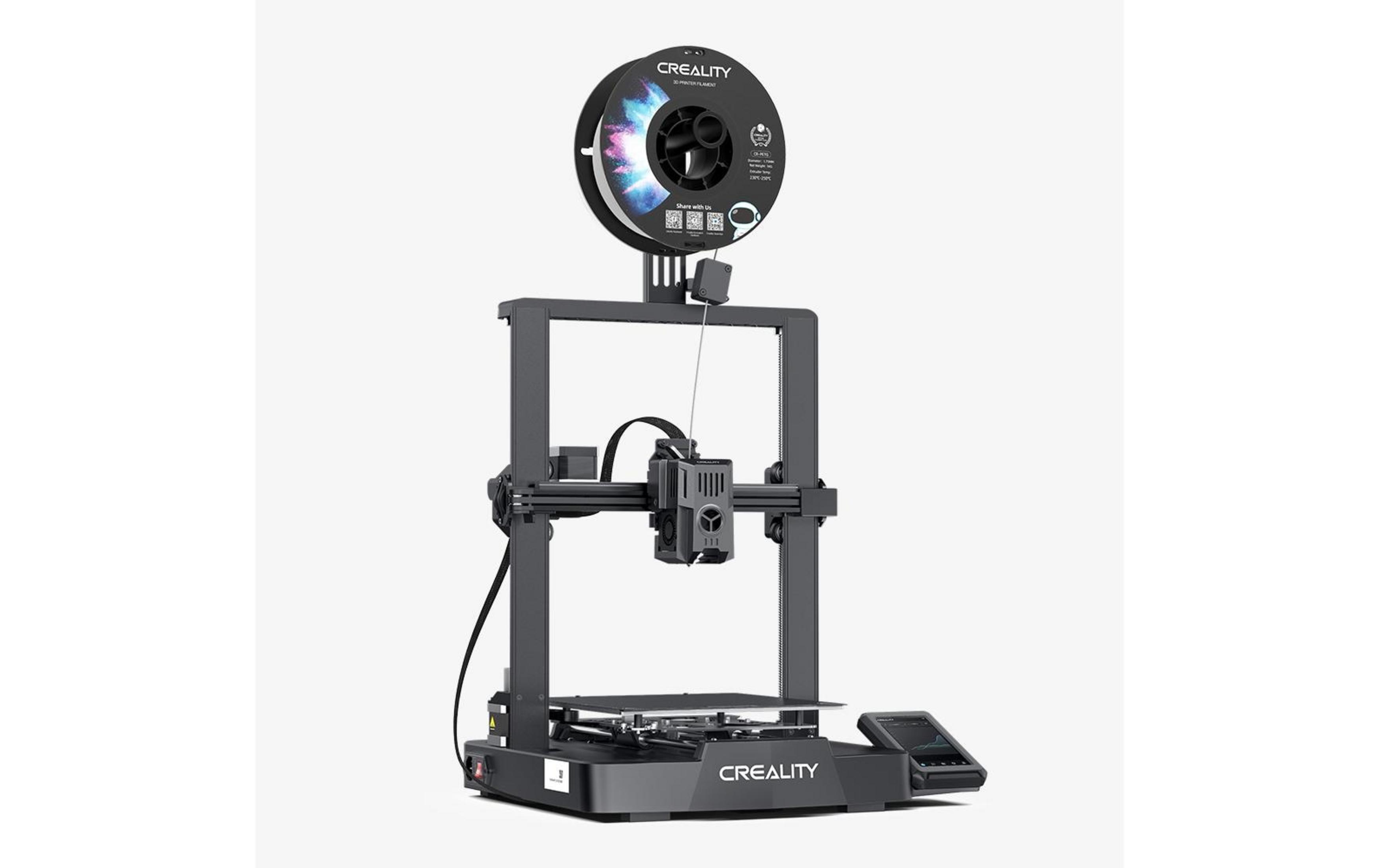 Ciemna drukarka 3D z nawiniętym filamentem na górze i panelem sterowania po prawej.