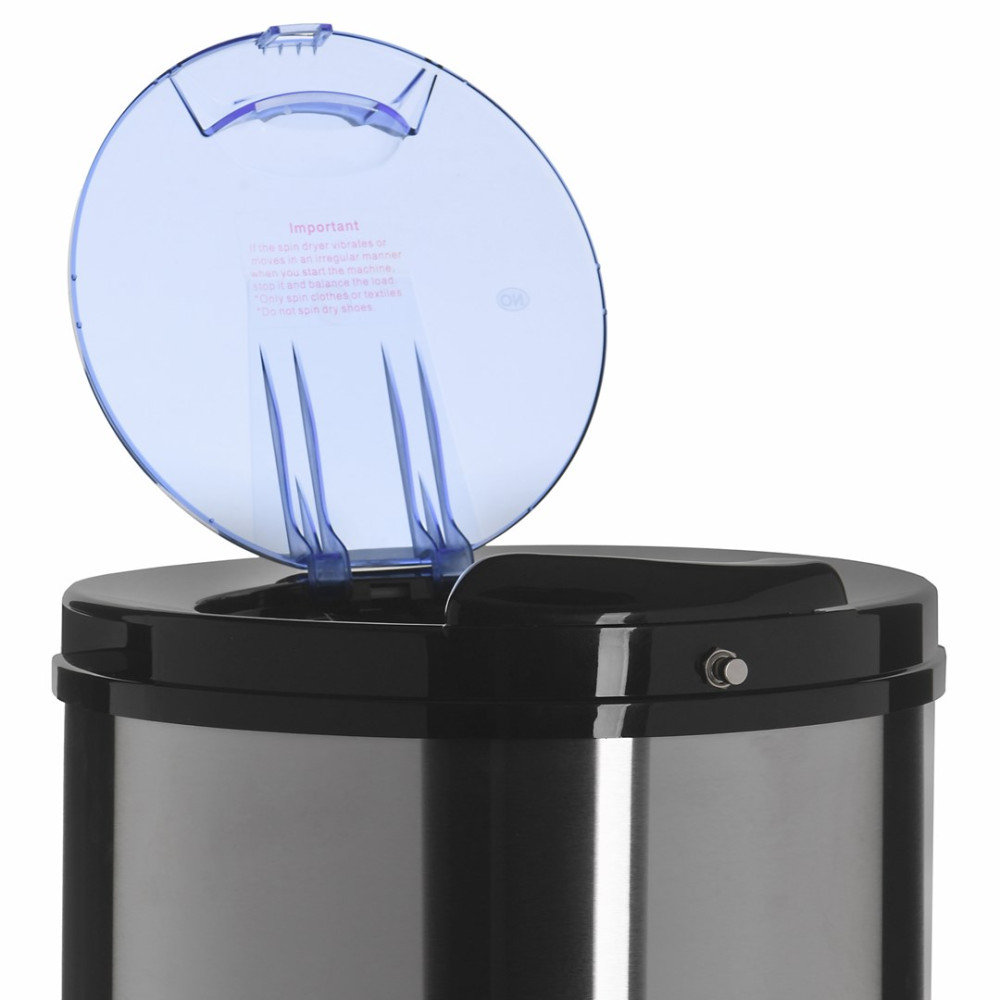 Wirówka ze stali nierdzewnej z otwartą niebieską pokrywą i ostrzeżeniami.