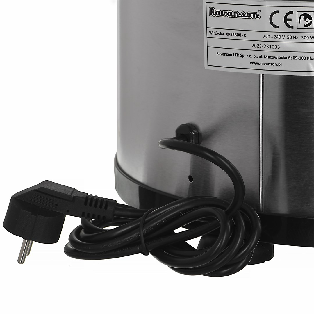 Urządzenie ze stali nierdzewnej z czarnym kablem i wtyczką, etykieta ze szczegółami technicznymi.