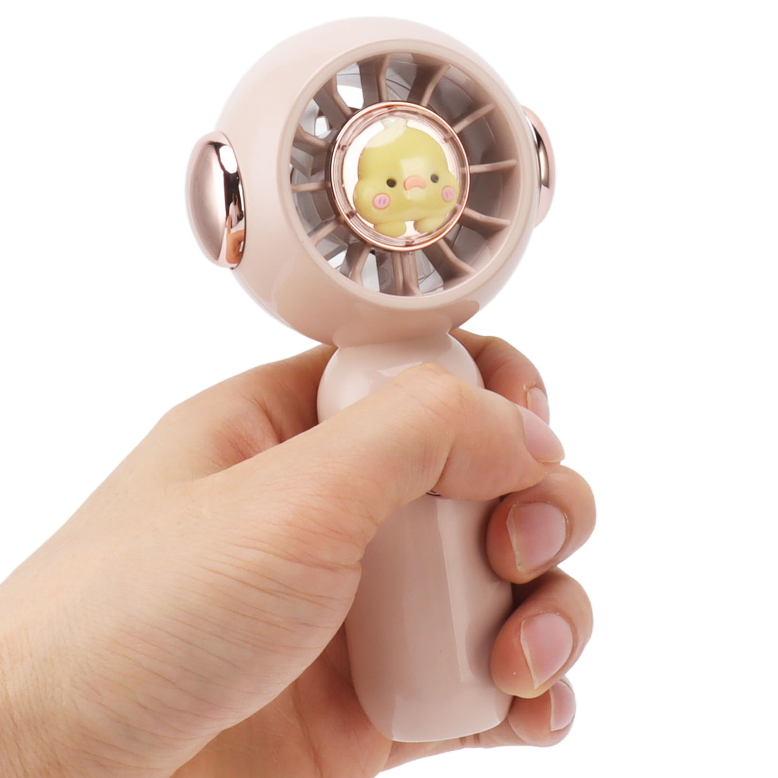 Ein rosa Ventilator mit einem gelben Entenbaby im Inneren, gehalten von einer Hand.
