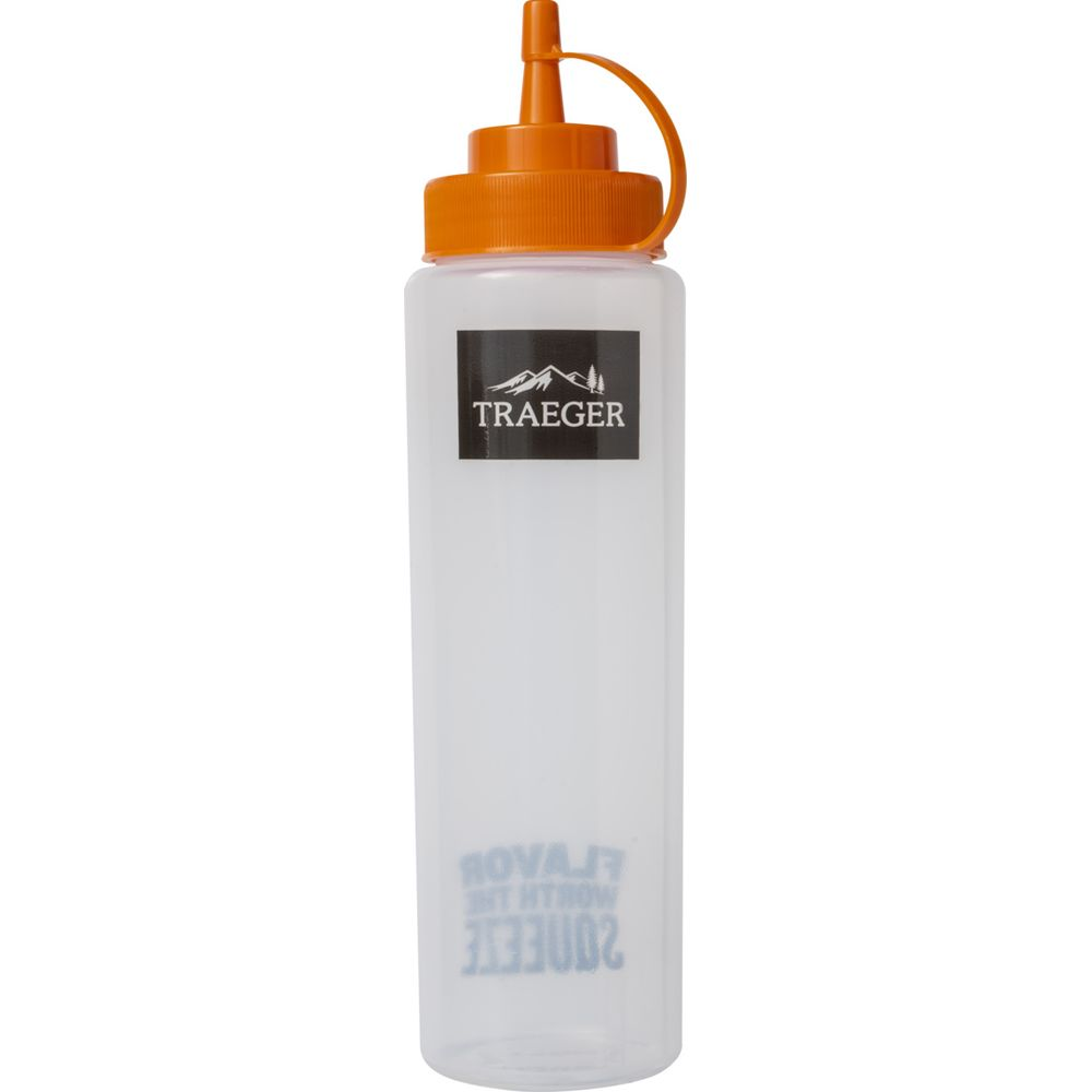 Eine durchsichtige Plastikflasche mit orangefarbenem Deckel und Ausgießer.