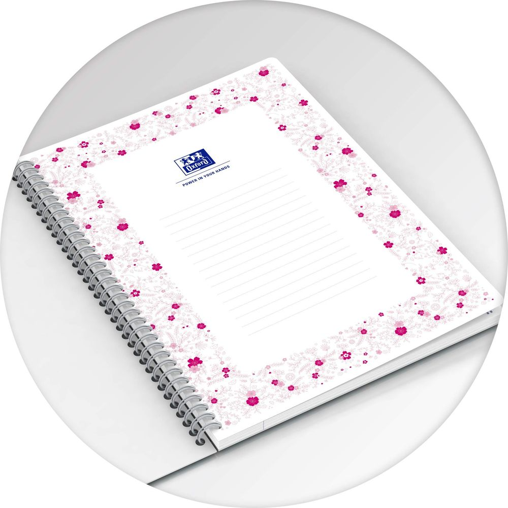 Ein Notizbuch mit Spiralbindung, weiß mit rosa Blumenmuster und dem Oxford-Logo.