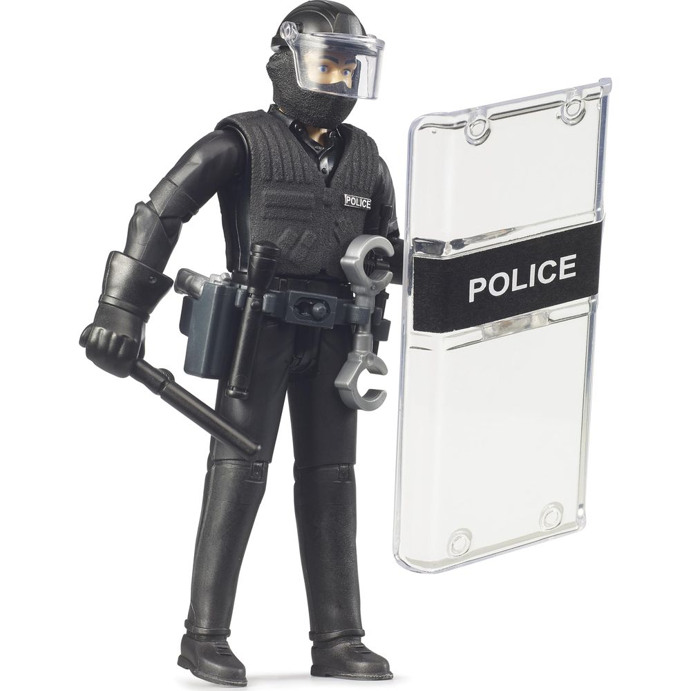 Eine Spielzeugfigur eines Polizisten in voller Montur mit Schild und Schlagstock.