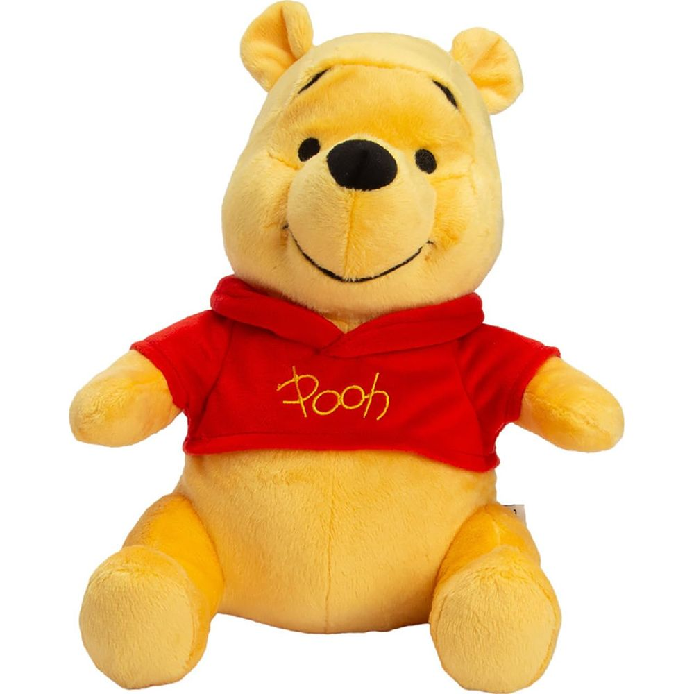 Peluche Winnie l'Ourson jaune portant un sweat rouge inscrit "Pooh".