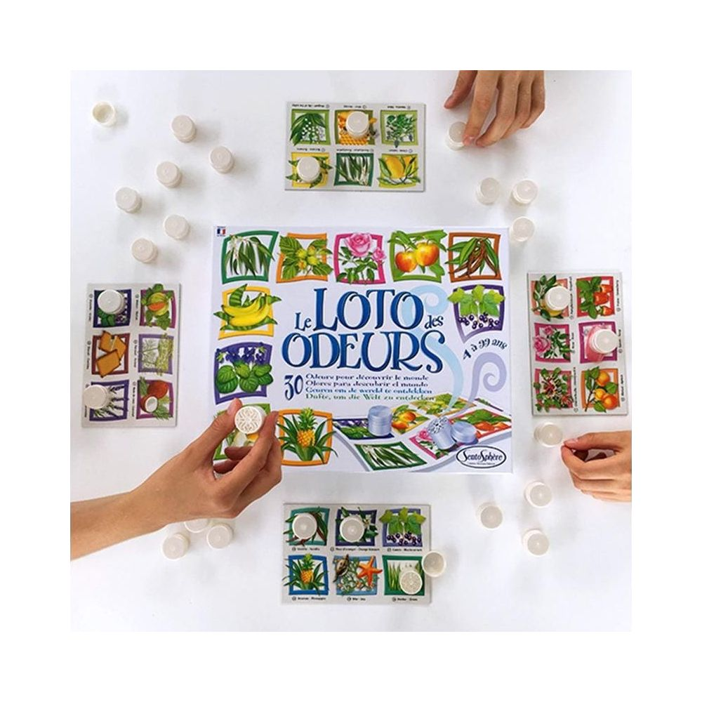Ein Brettspiel mit Bildern von Früchten und Blumen und weißen Chips.