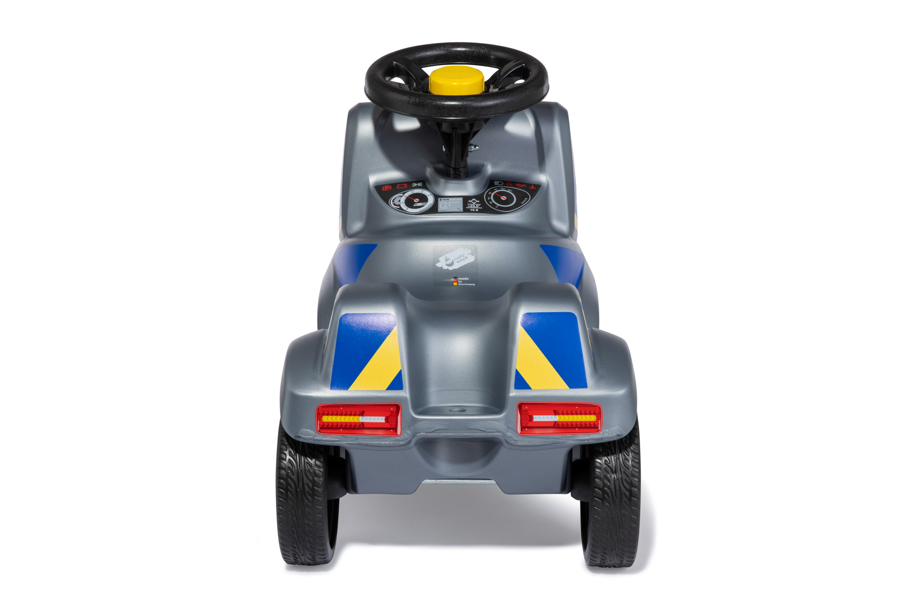 Graues Kinderfahrzeug mit schwarzem Lenkrad, gelber Hupe und blauen/gelben Streifen.