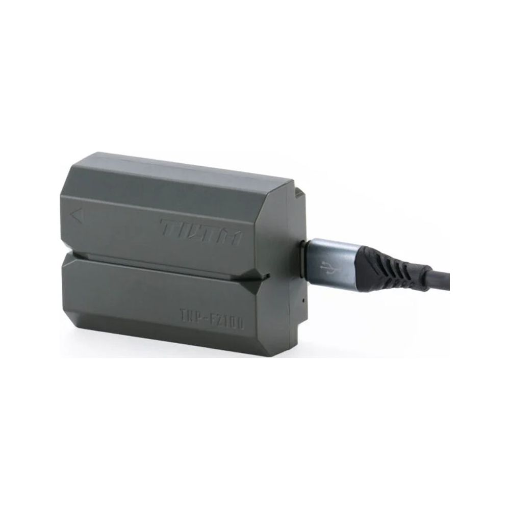Dispositivo adattatore grigio con cavo USB collegato sul lato.