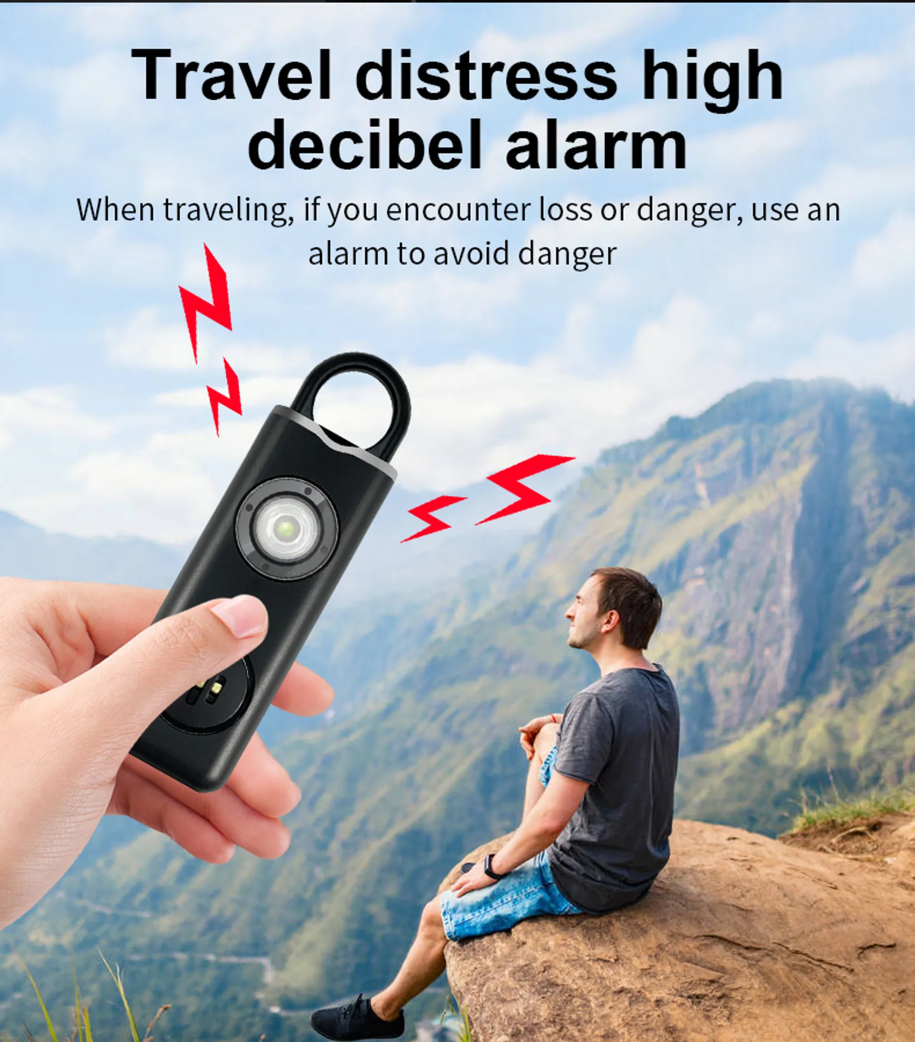Eine Hand hält einen schwarzen Alarm mit Licht. Ein Mann sitzt auf einem Felsen.