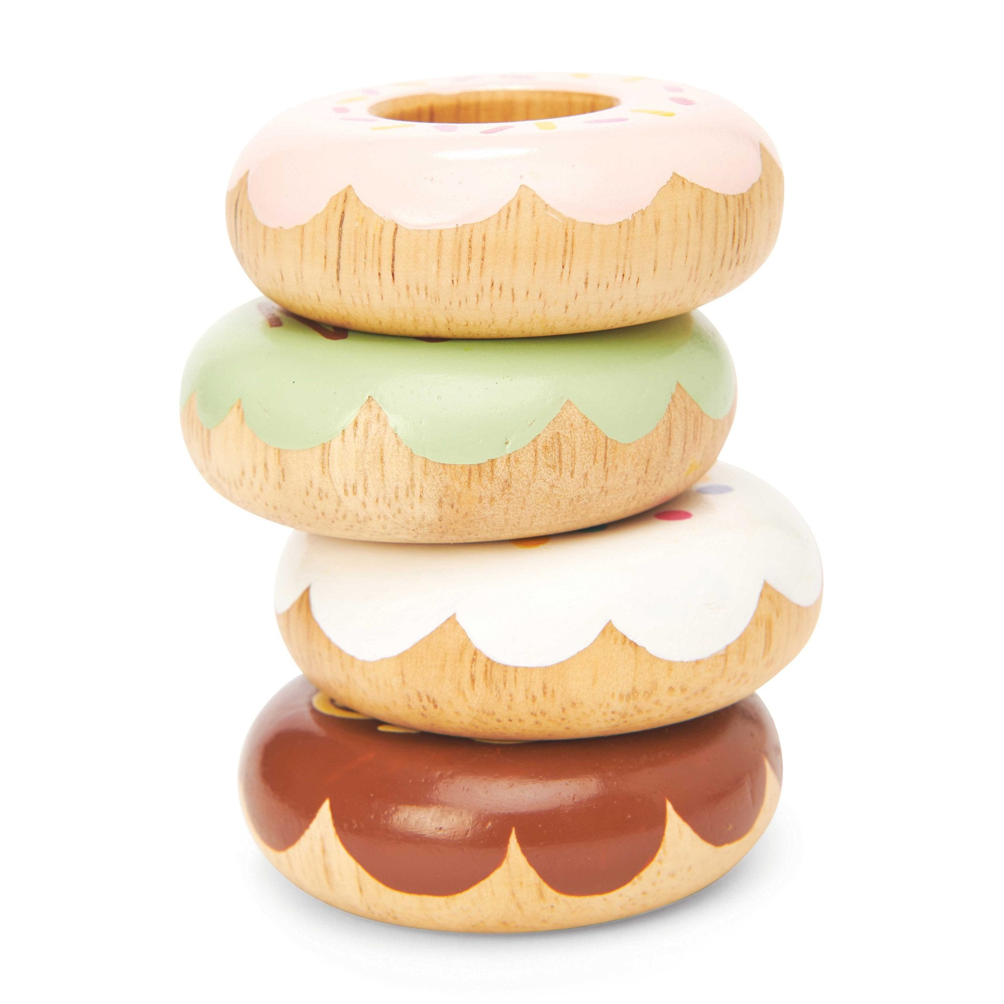 Ein Stapel aus vier hölzernen Spielzeug-Donuts in Rosa, Grün, Weiß und Braun.