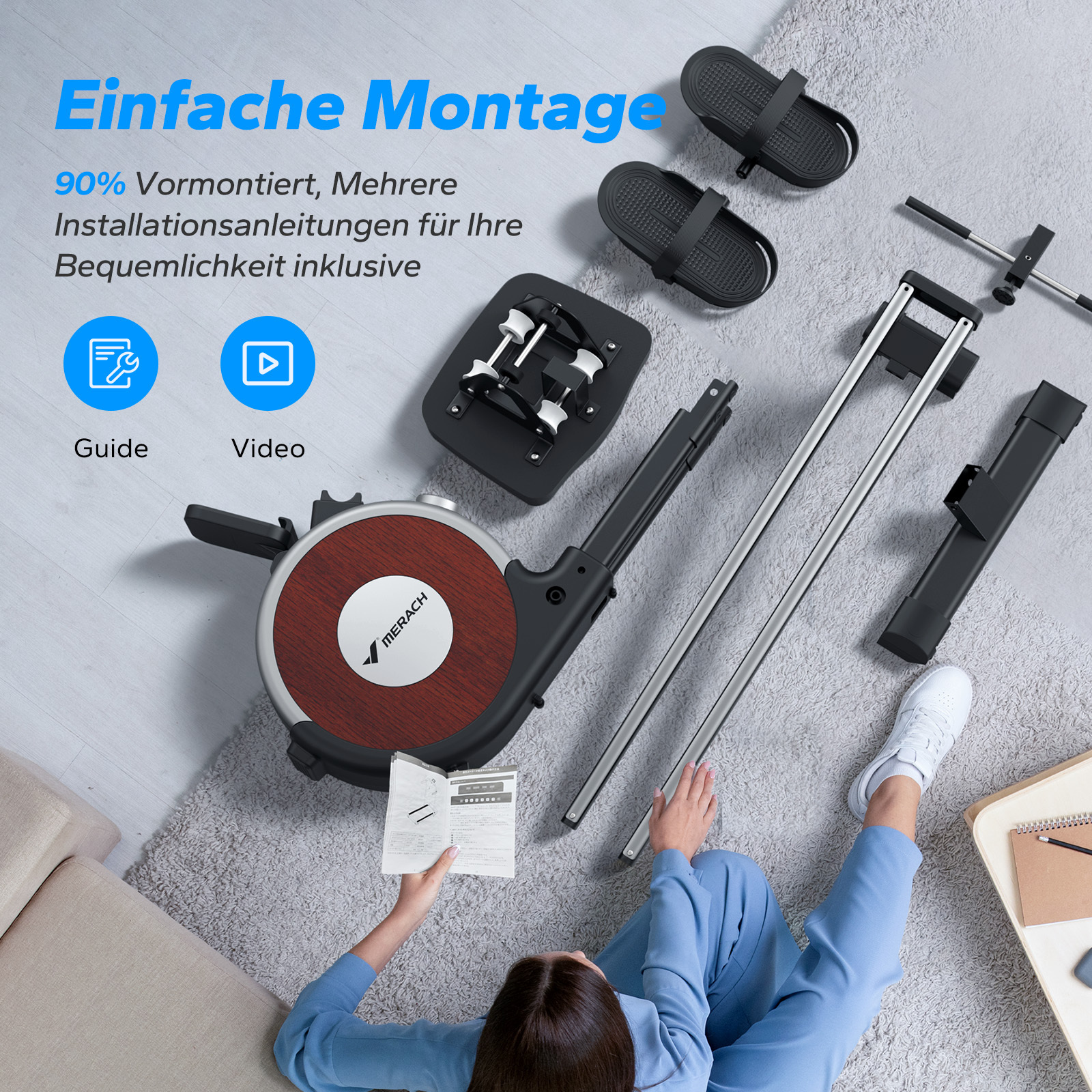 Teile eines Heimtrainers liegen auf einem Teppich, mit Anleitung und Fußschlaufen.