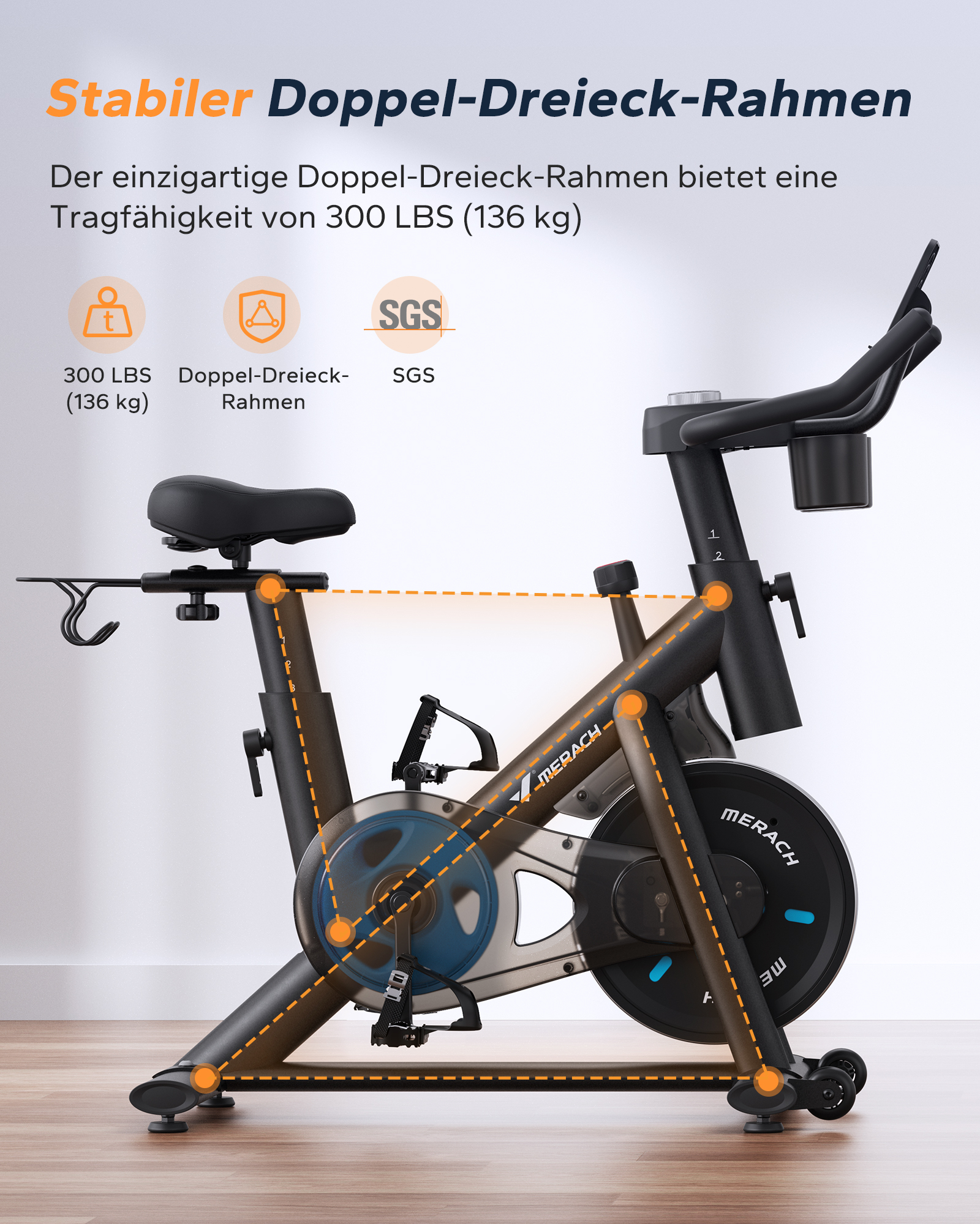 Ein schwarzes Indoor-Fahrrad mit orangefarbener Rahmenzeichnung und Text.