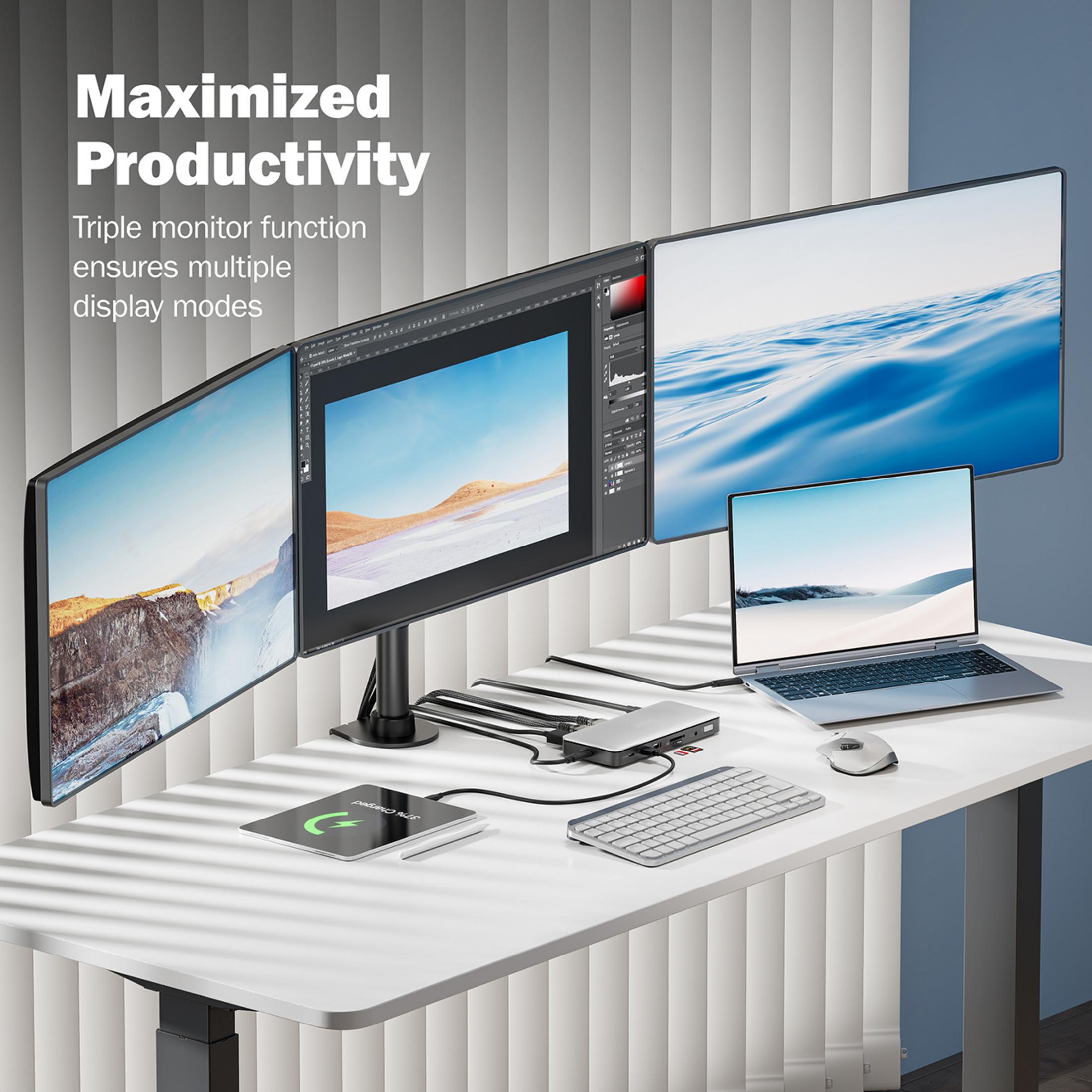 Ein Schreibtisch mit drei Monitoren, Laptop, Tastatur, Maus und Dockingstation.