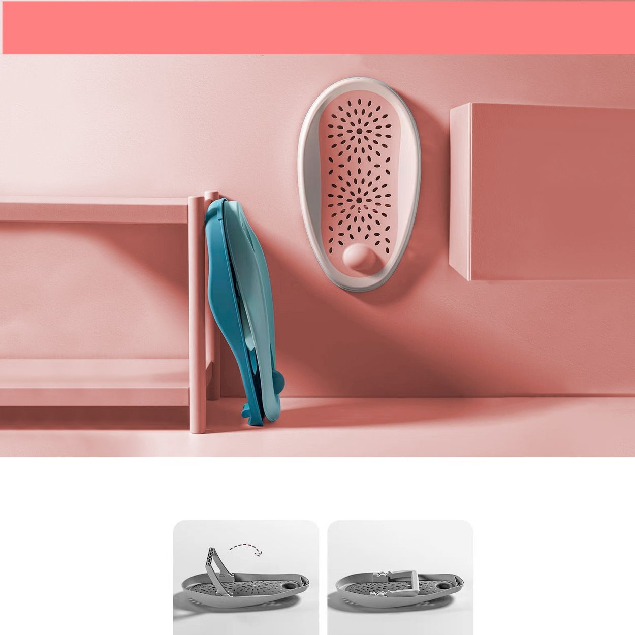 Ein blauer Baby-Badehelfer steht neben einem rosafarbenen Regal. Ein weiteres rosa Badewannen-Set ist an der Wand montiert.