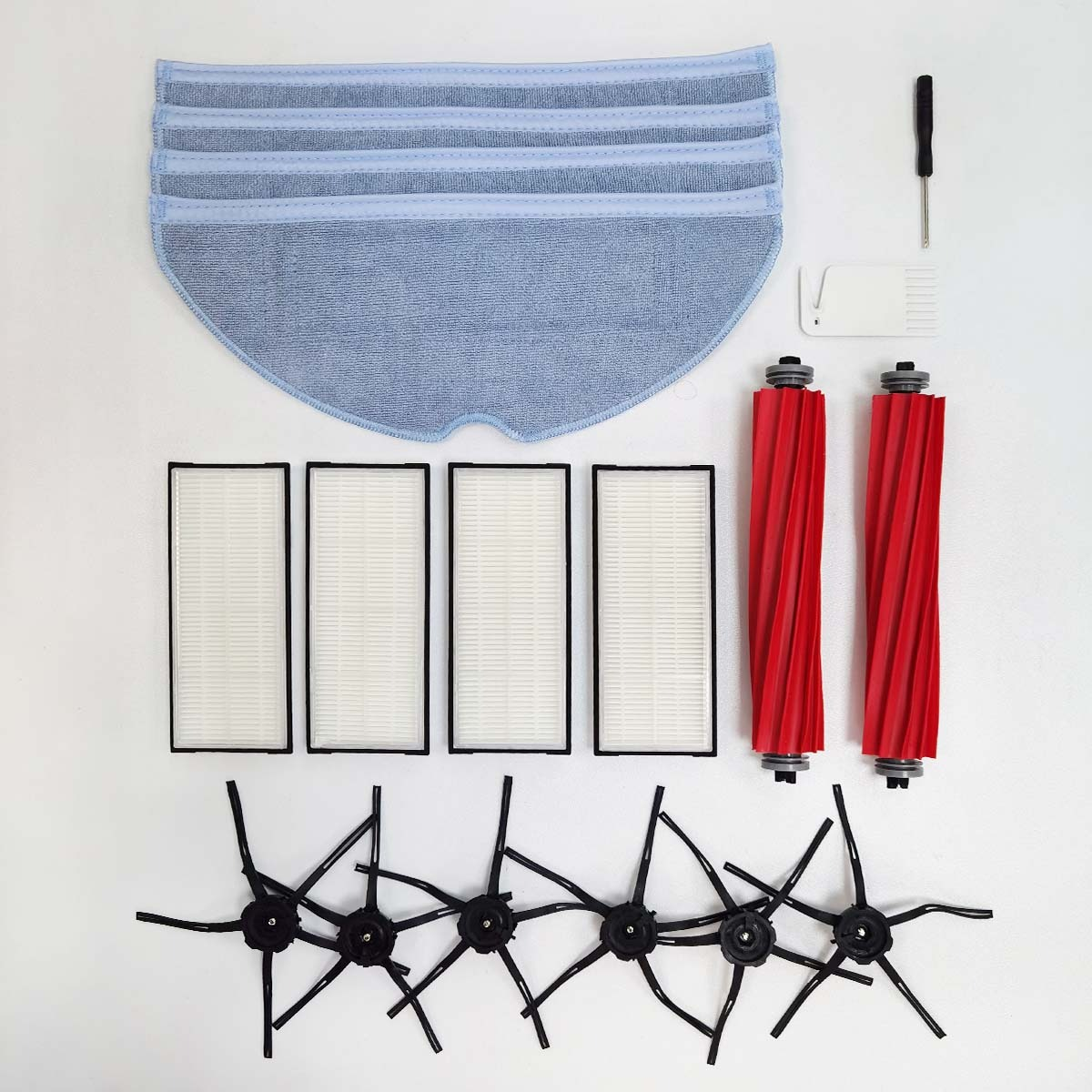 Akcesoria do czyszczenia odkurzacza robota: ściereczka, filtry, szczotki i narzędzia.