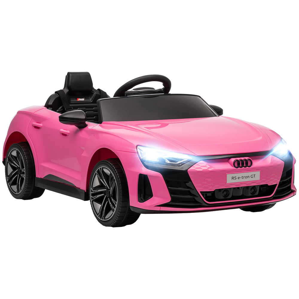 Un coche de juguete Audi RS e-tron GT rosa con ruedas negras y luces encendidas.