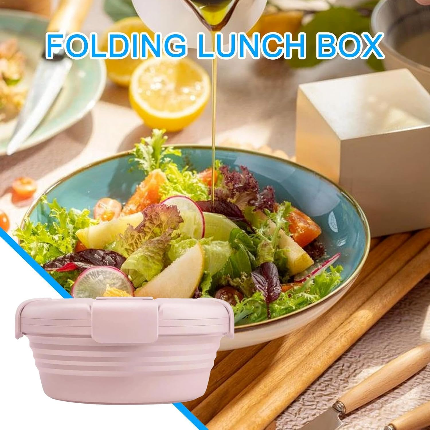 Ein rosafarbener faltbarer Lunchbox neben einem Salat mit Zitronen.