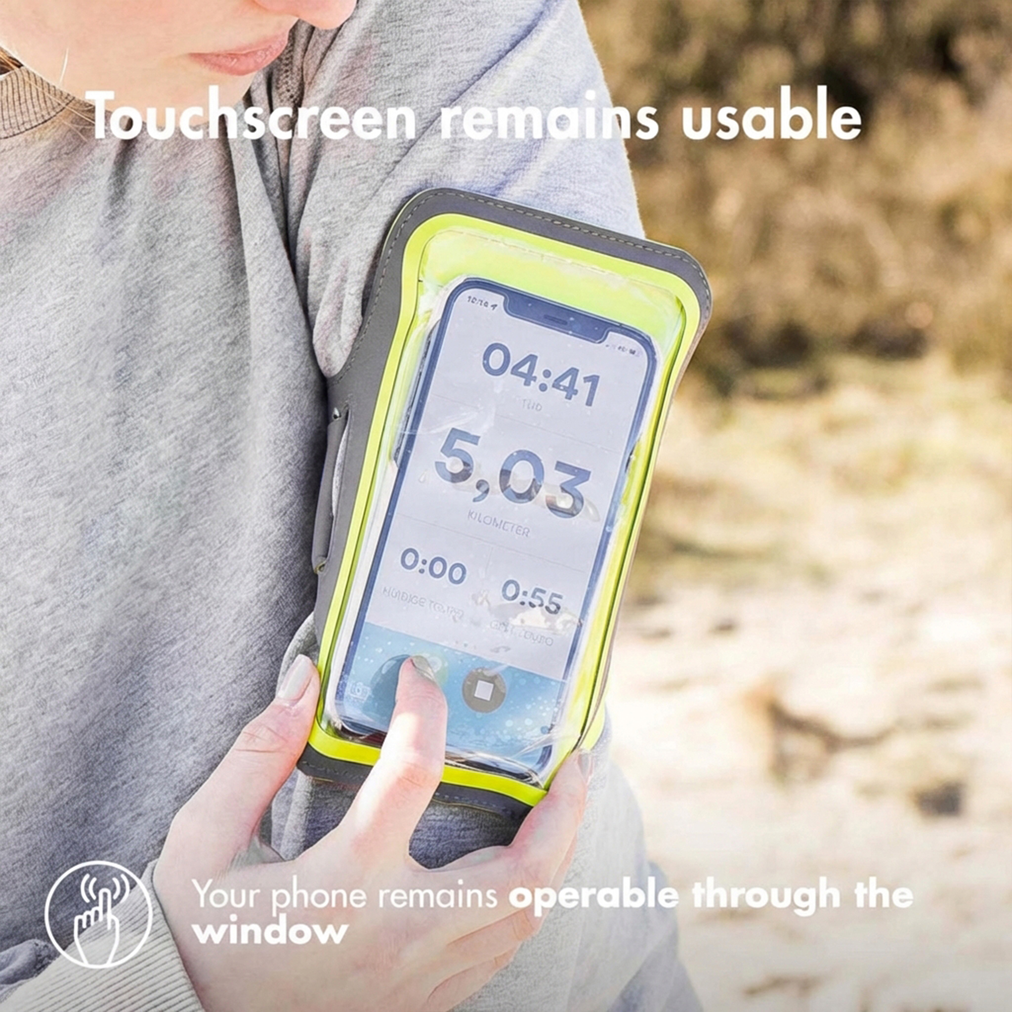 A person wears an armband with a smartphone showing 5.03 km.
