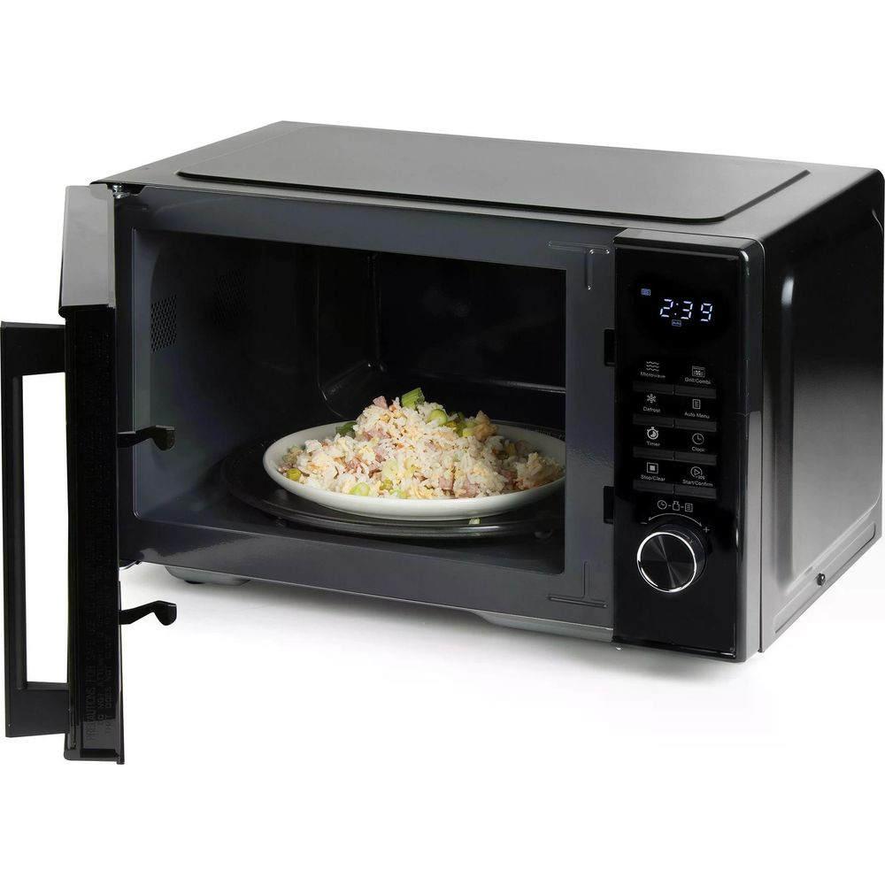 Un micro-ondes porte ouverte, contenant un bol de riz frit.