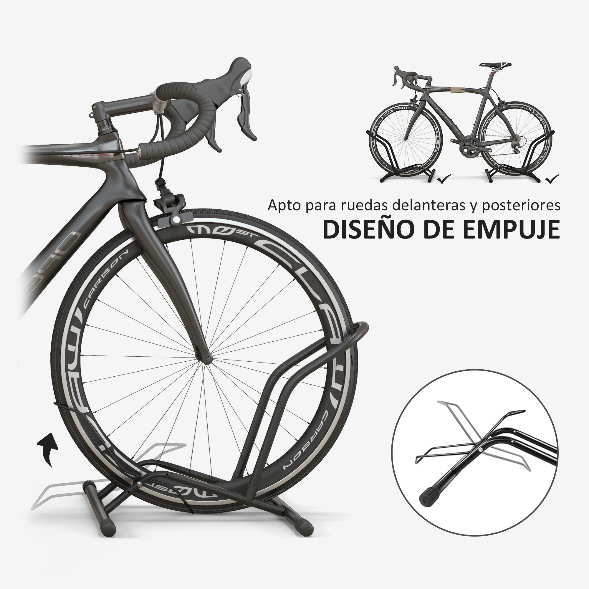 Una bicicleta de carretera negra se muestra en un soporte negro. Primer plano de la rueda delantera.