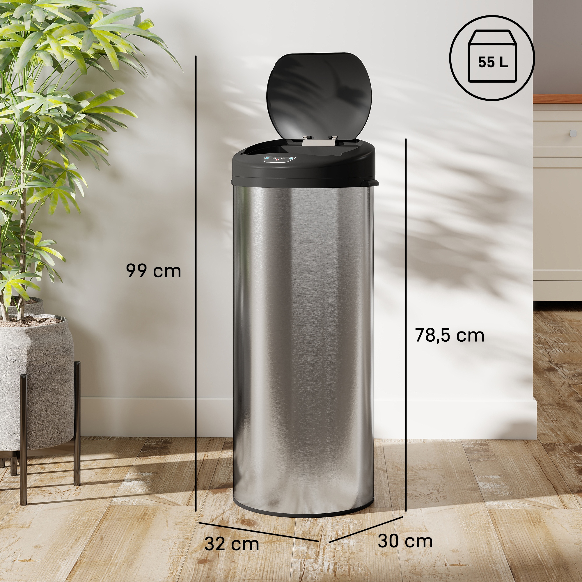 Un cubo de basura plateado (55 L, 99 cm de alto) con tapa negra abierta está sobre un suelo de madera.